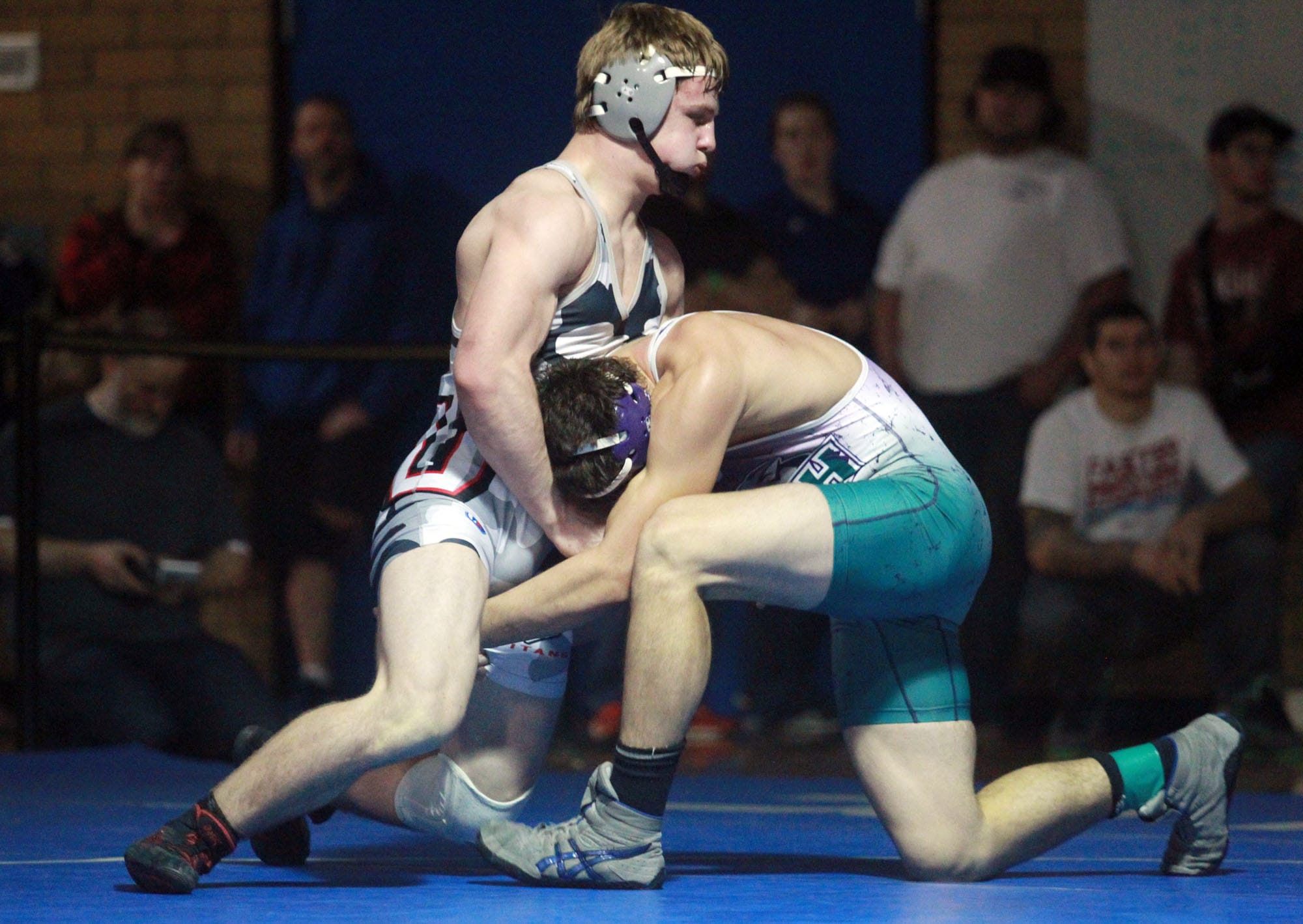 Alex Berfanger of Union High School, left, wrestles  at the Clark County Wrestling Championships in January.