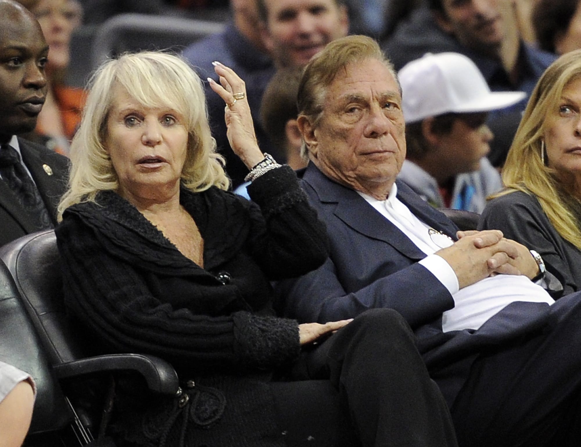 Los Angeles Clippers owner Donald T. Sterling sits with his wife Shelly during the Clippers NBA basketball game against the Detroit Pistons on Nov. 12, 2010 in Los Angeles. Donald Sterling has agreed to surrender his stake of the Clippers to his wife, and she is moving forward with selling the team.