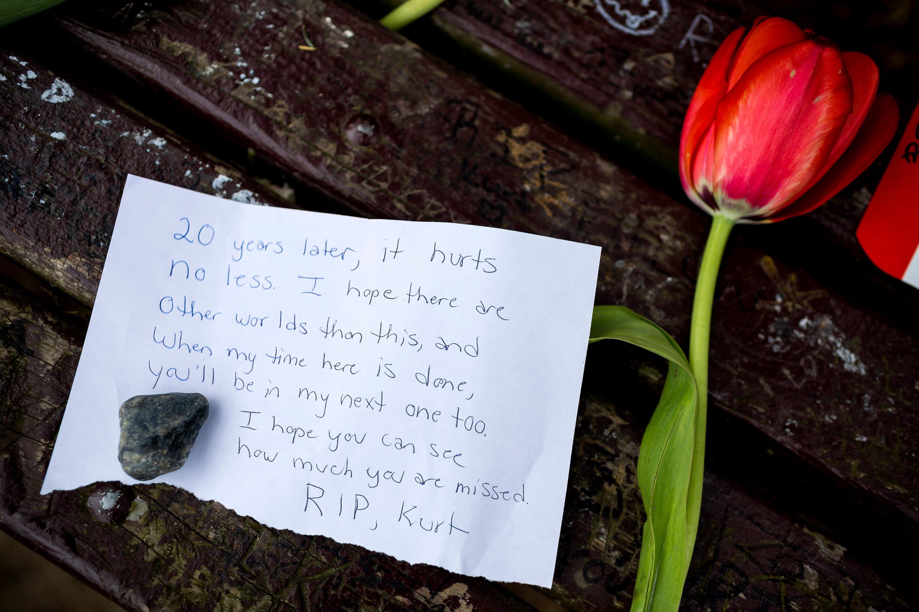 Fans of Nirvana's lead singer, Kurt Cobain, paid homage to the late rock icon with offerings of flowers, unopened beers and handwritten notes on a bench near the home where Cobain died on the 20th anniversary of his death April 5 at Viretta Park in Seattle.
