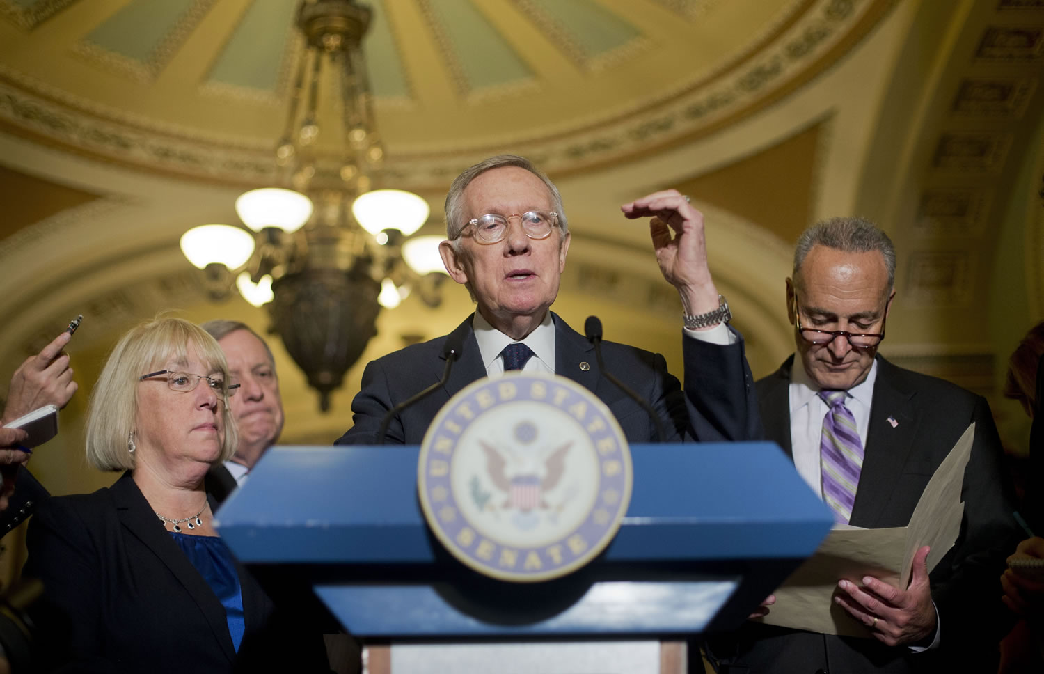 Senate Minority Leader Harry Reid of Nevada, center, speaks to reporters on Capitol Hill in Washington on Wednesday. Joining Reid from left are Sen. Patty Murray, D-Wash., Senate Minority Whip Richard Durbin of Ill.,  left, and Sen. Charles Schumer, D-N.Y., right.
