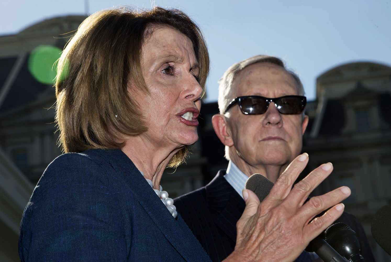 House Minority Leader Nancy Pelosi of California, left, accompanied by Senate Minority Leader Harry Reid of Nevada, speaks to reporters outside the West Wing of the White House in Washington on Thursday after a meeting with President Barack Obama.