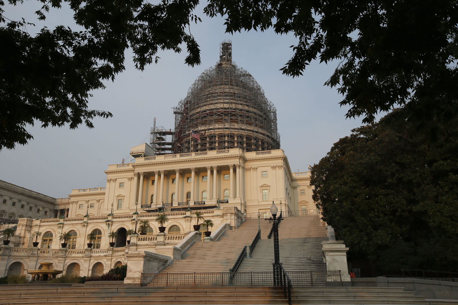 The west front of the U.S. Capitol is seen under repair Sept. 2, 2015 in Washington. Congress returns on Sept. 8 with a critical need for a characteristic that has been rare through a contentious spring and summer _ cooperation between Republicans and President Barack Obama. Lawmakers face a weighty list of unfinished business and looming deadlines, with a stopgap spending bill to keep the government open on Oct. 1 paramount.