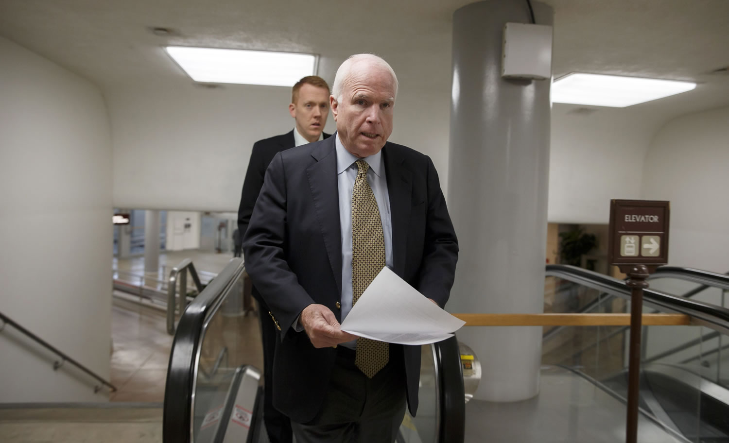 Sen. John McCain, R-Ariz., a member of the Senate Foreign Relations Committee, heads to the chamber to advance a bill providing $1 billion in loan guarantees to Ukraine as President Barack Obama meets with U.S.