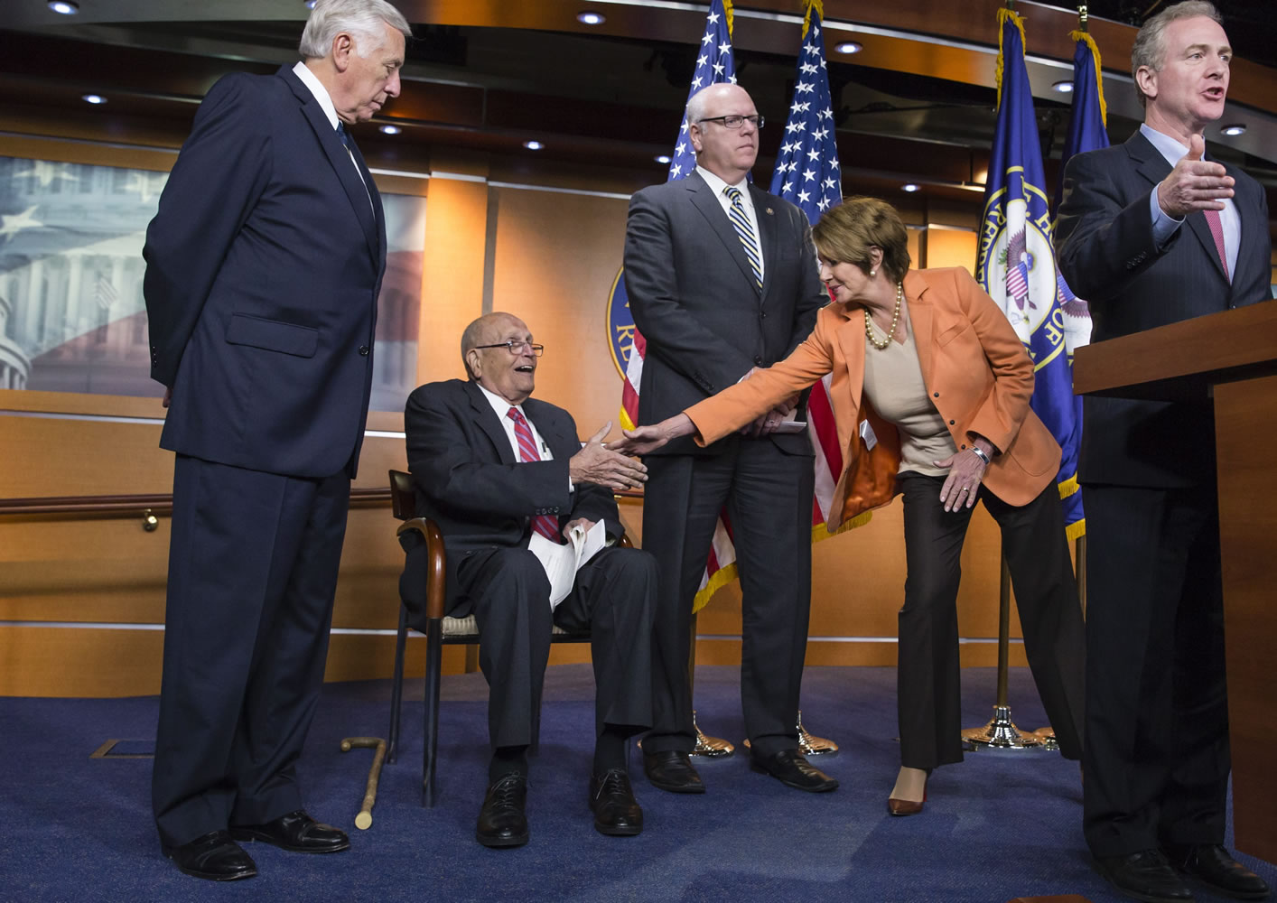 House Minority Leader Nancy Pelosi of Calif., reaches out to shake hands with Rep. John Dingell, D-Mich., the longest-serving member of Congress in history, at a news conference in October on Capitol Hill in Washington. From left are Minority Whip Steny Hoyer, D-Md., Rep. John Dingell, D-Mich., Rep. Joseph Crowley, D-N.Y., House Minority Leader Nancy Pelosi, D-Calif., and Rep.