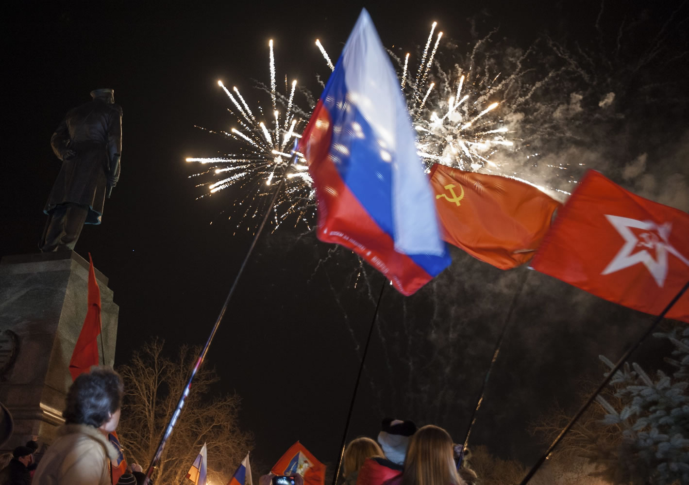 People watch fireworks at the central Nakhimov Square in Sevastopol, Crimea, on Friday.