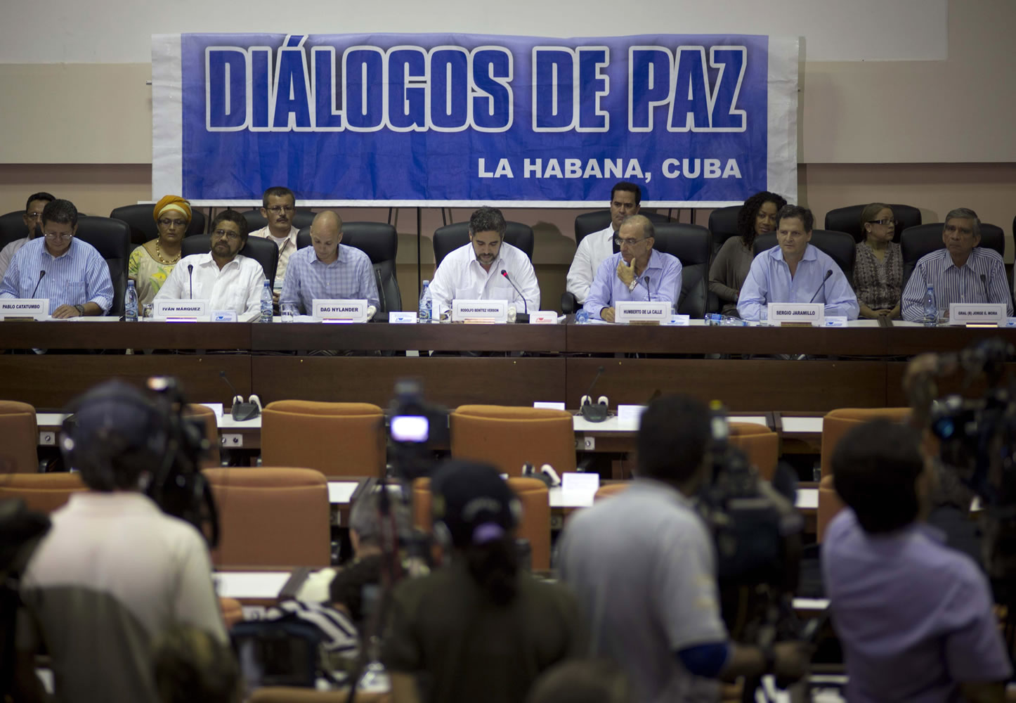 Negotiators from the Revolutionary Armed Forces of Colombia (FARC), left, and Colombia's government, right, give a press conference under a sign that reads in Spanish &quot;Peace Talks&quot; in Havana, Cuba, earlier this year.