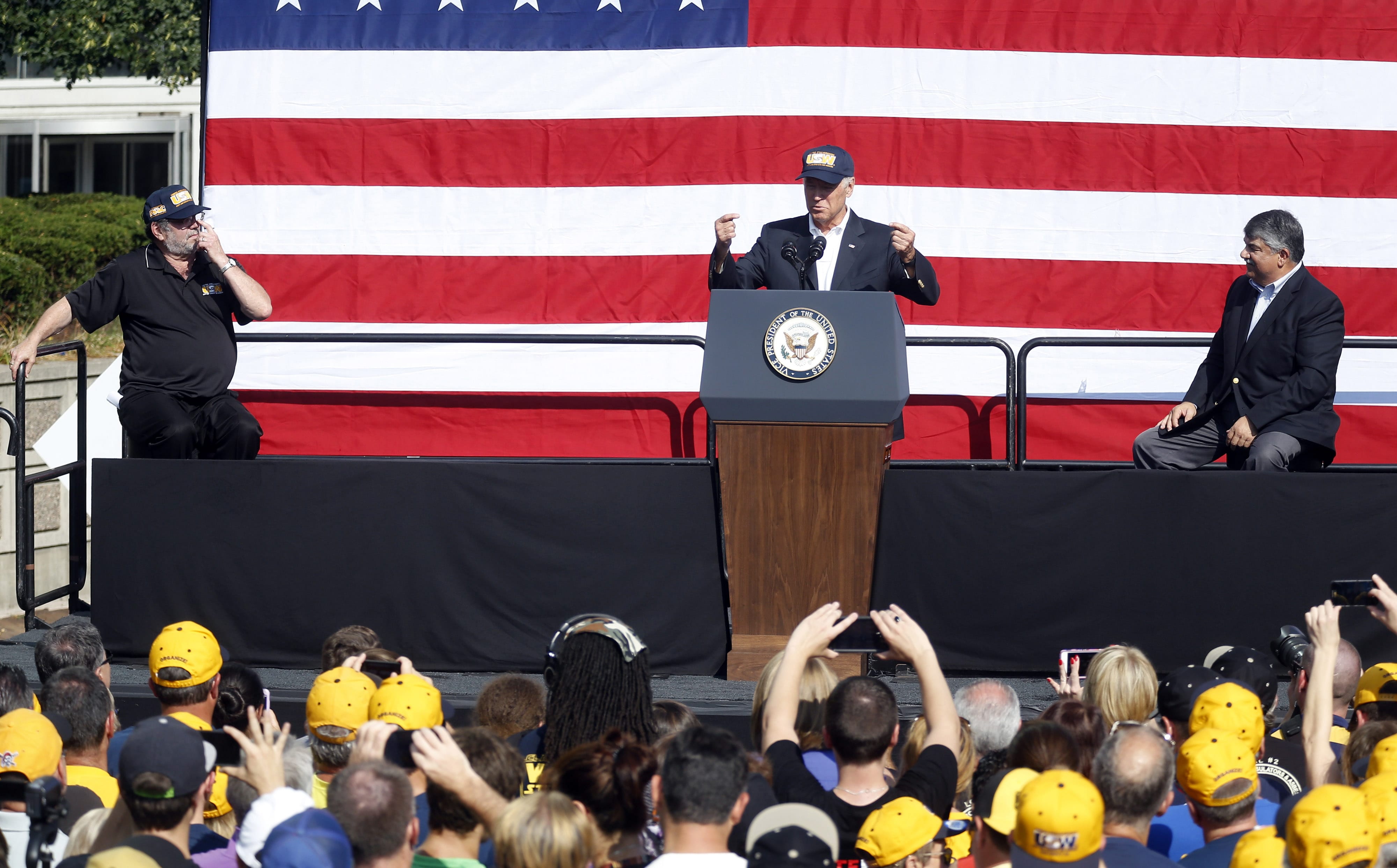 Vice President Joe Biden, center, speaks to a crowd with United Steelworkers President Leo Gerard, left, and AFL-CIO President Rich Trumka, right, before he joins joins in the annual Labor Day parade on Monday  in Pittsburgh.