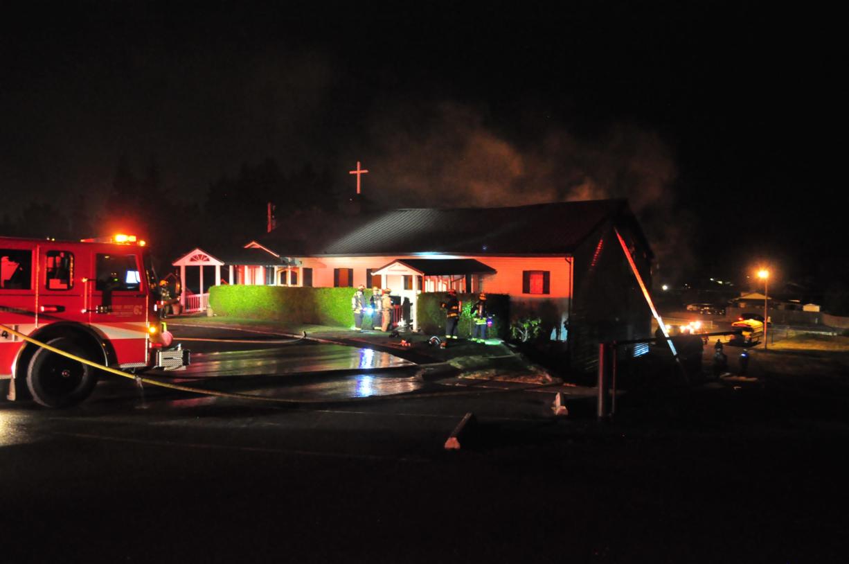 Firefighters respond early Sunday morning to a fire that tore through Amazing Grace Baptist Church in Hazel Dell. Investigators said the fire started outside, and they are asking for any witnesses in the case to contact them.
