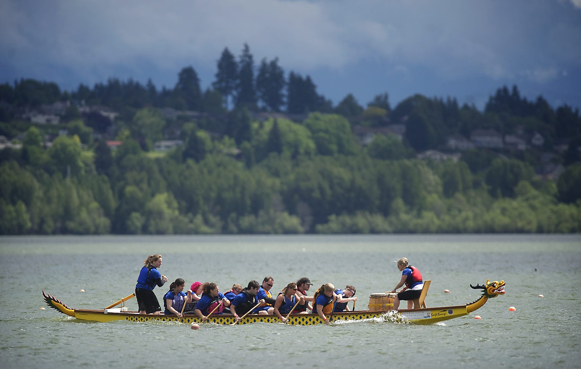 Team Fusion competes in dragon boat races to benefit Paddle for Life at Vancouver Lake.