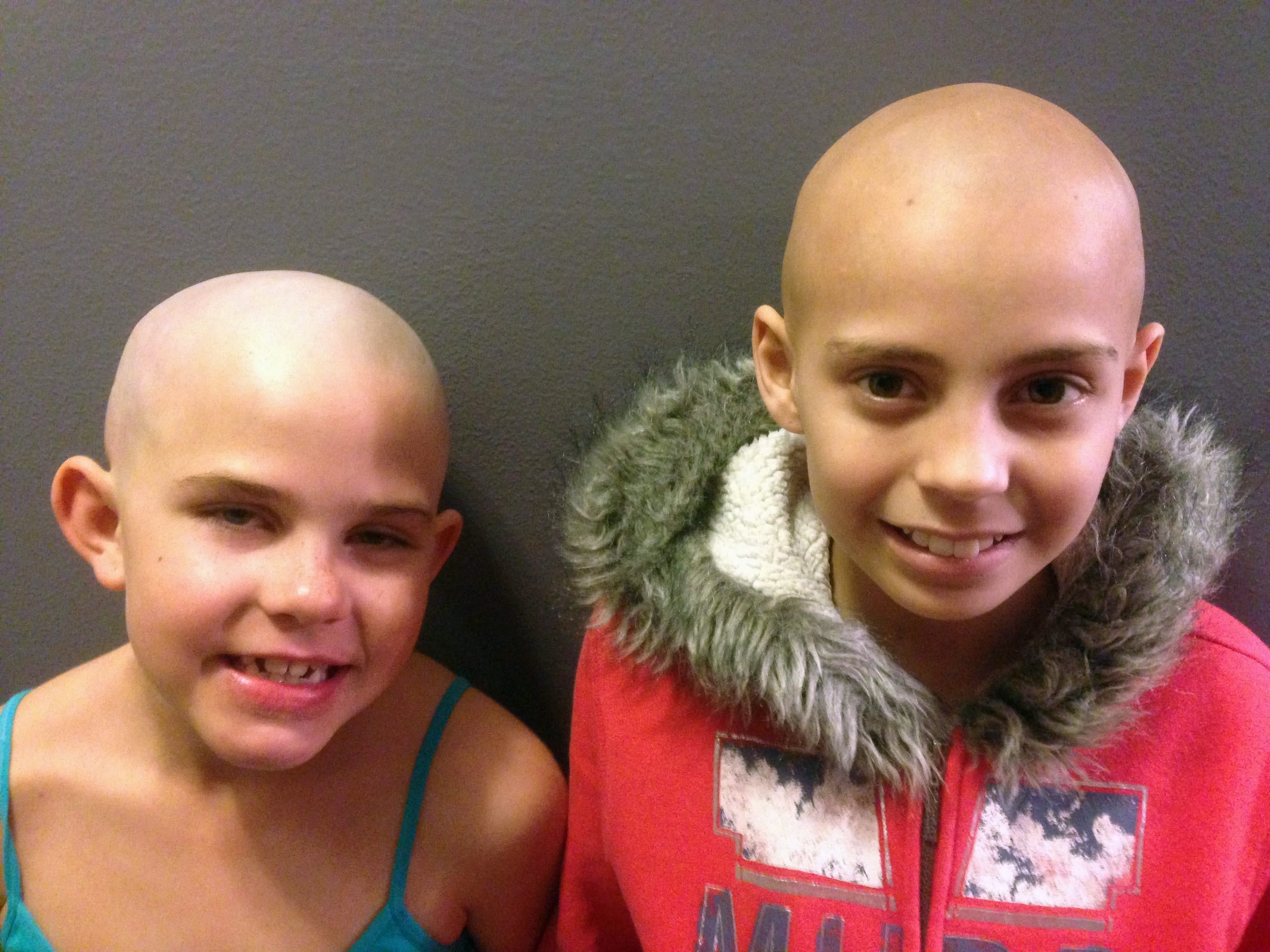 Contributed photo
Kamryn Renfro, 9, left, sharved her head after friend Delaney Clements, 11, lost her hair during treatment for cancer. Kamryn was suspended from her Grand Junction, Colo., school, though the decision was quickly reversed.