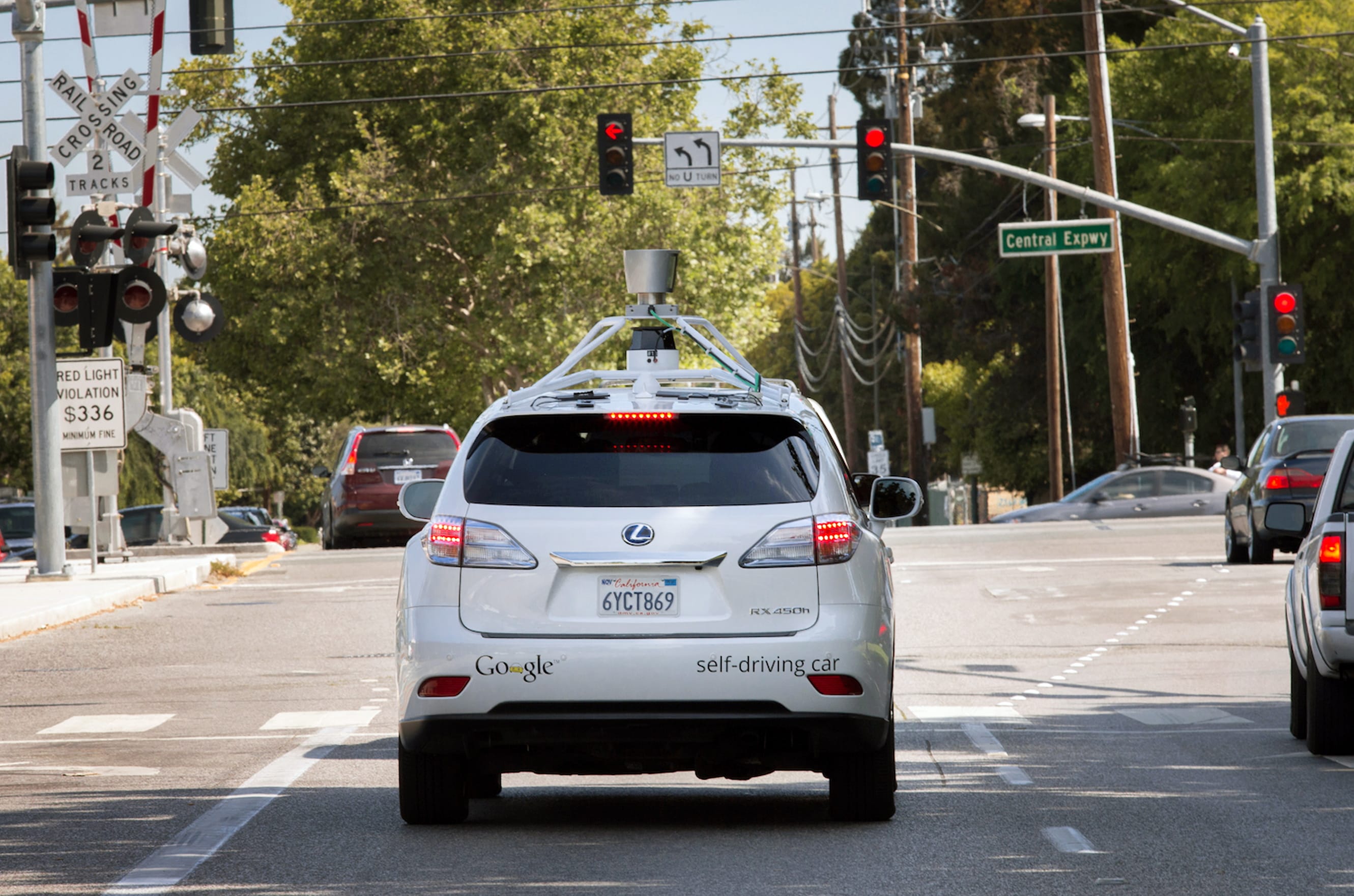 A Google driverless car navigates a street in Mountain View, Calif.