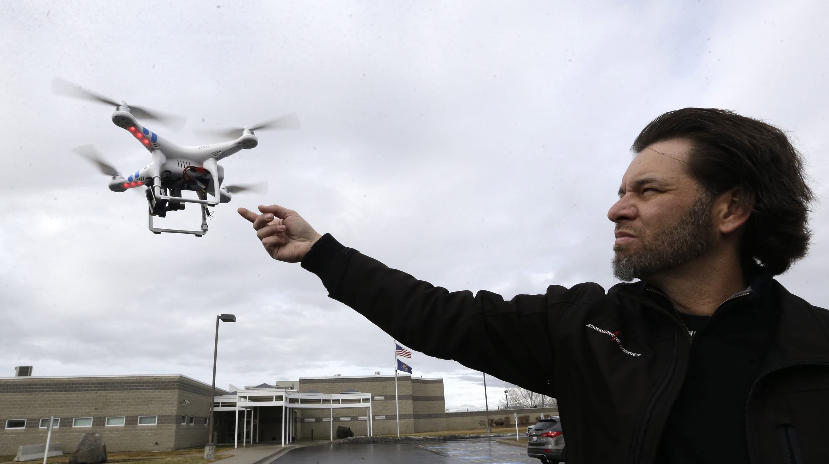 Jon McBride, who designs and builds drones with Digital Defense Surveillance, flies a training drone for members of the the Box Elder County Sheriff's Office search and rescue team during a February demonstration in Utah. The Obama administration is on the verge of proposing long-awaited rules for commercial drone operations in U.S.