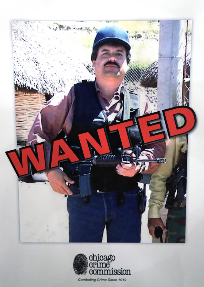 A poster displayed Feb. 14, 2013, in Chicago, shows Joaquin &quot;El Chapo'' Guzman, who was deemed Chicago's Public Enemy No. 1. The only other person so named was Al Capone. His cartel has been heavily involved in the bloody drug war that has torn through parts of Mexico for the last several years. (AP Photo/M.