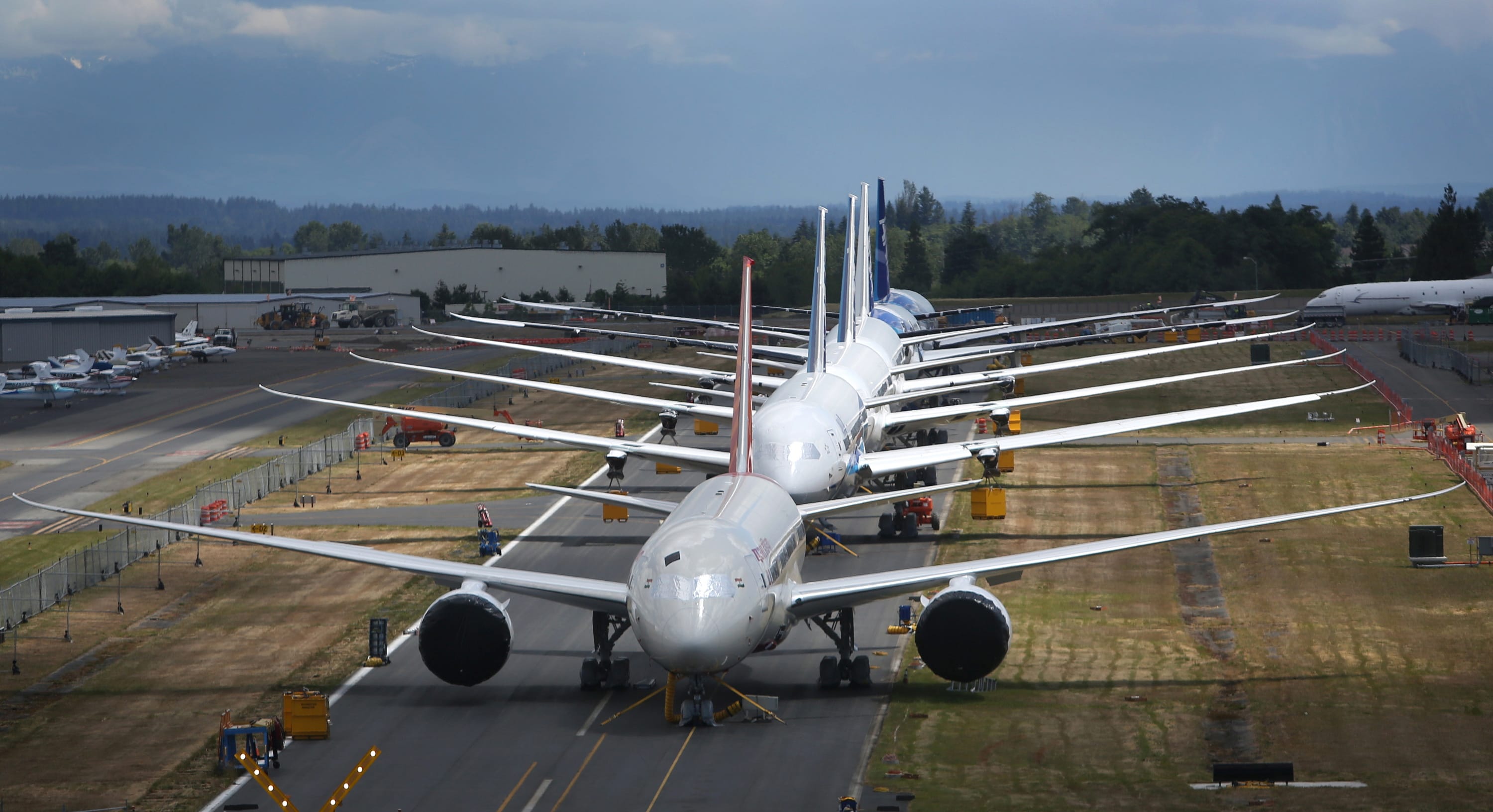 A line of Boeing 787 Dreamliners waiting to be delivered on a closed runway at Paine Field near Boeing's Everett assembly plant.