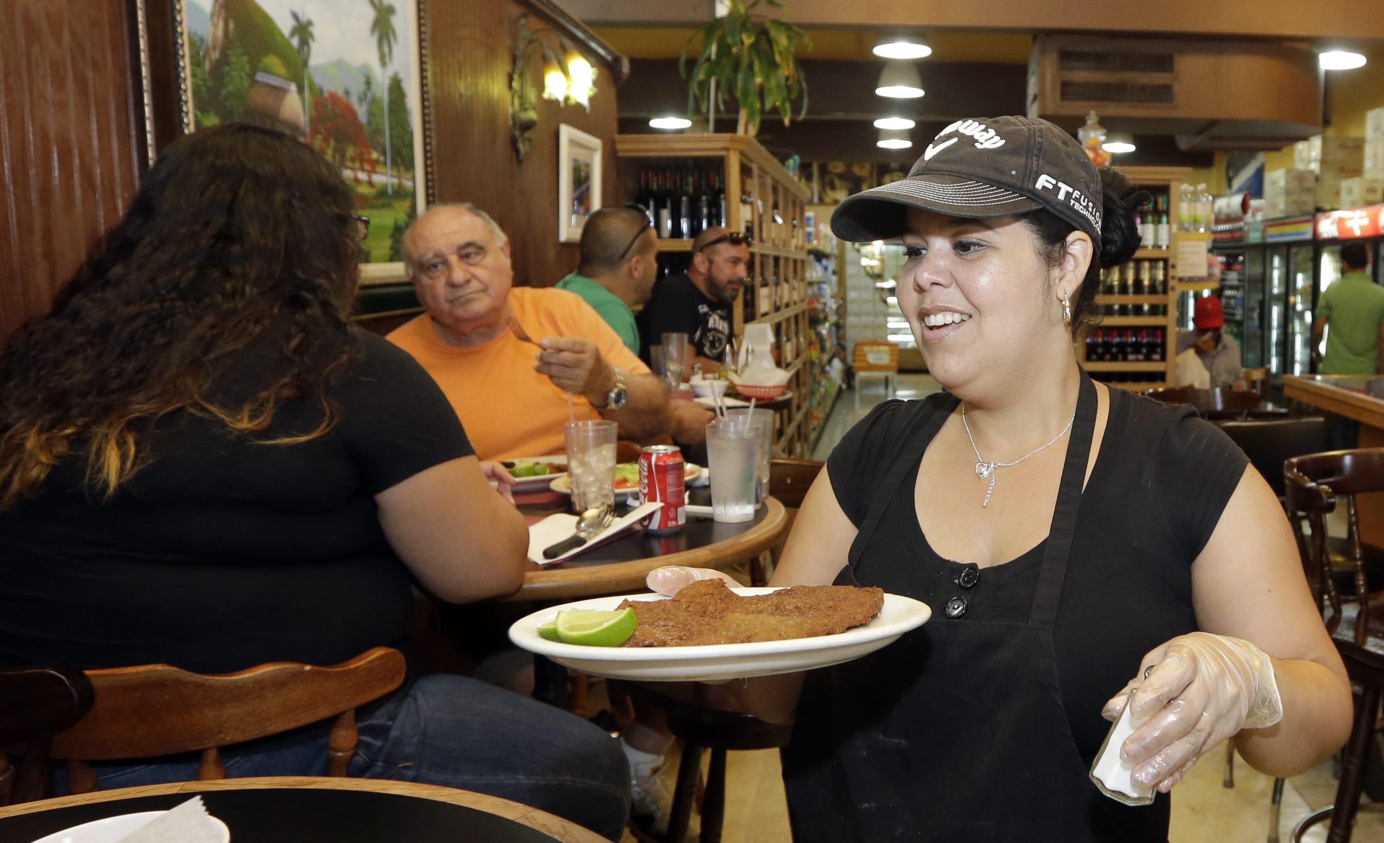 Judith Castro serves a lunch order at a local grocery store  June 12 in the Little Havana area of Miami. The Institute for Supply Management, a trade group of purchasing managers, issues its index of non-manufacturing activity for August 2015 on Thursday.