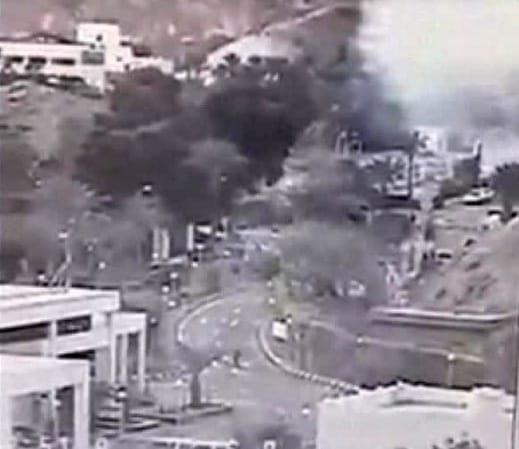 An image made from a video provided by the Israeli Airports Authority shows smoke from the bombing of a bus carrying South Korean sightseers near the tip of the Red Sea's Gulf of Aqaba on Sunday.