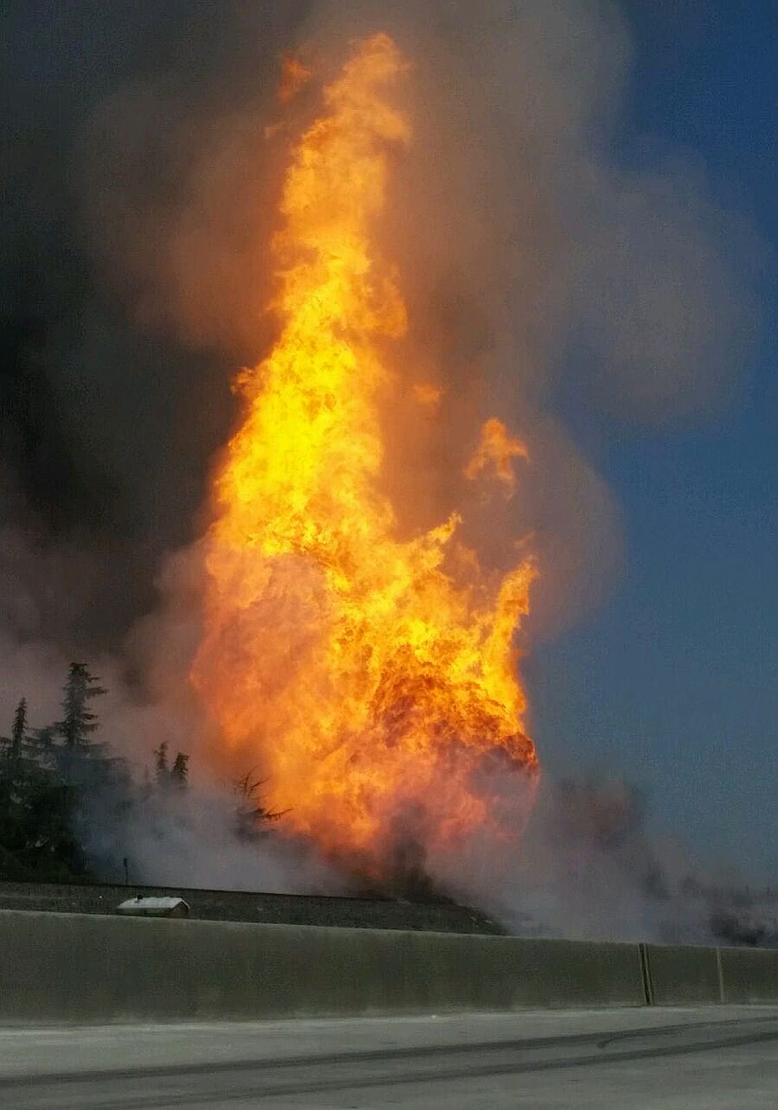 A fireball erupts after a large gas pipeline exploded in Fresno, Calif., Friday.