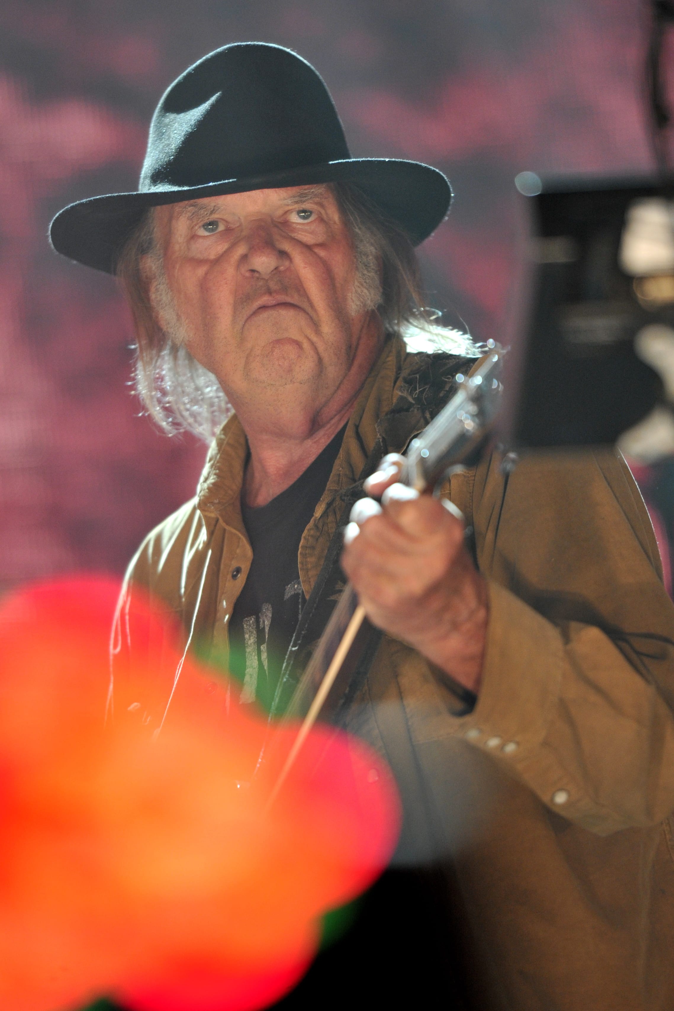 Neil Young performs at Farm Aid 30 at FirstMerit Bank Pavilion at Northerly Island on Saturday in Chicago.