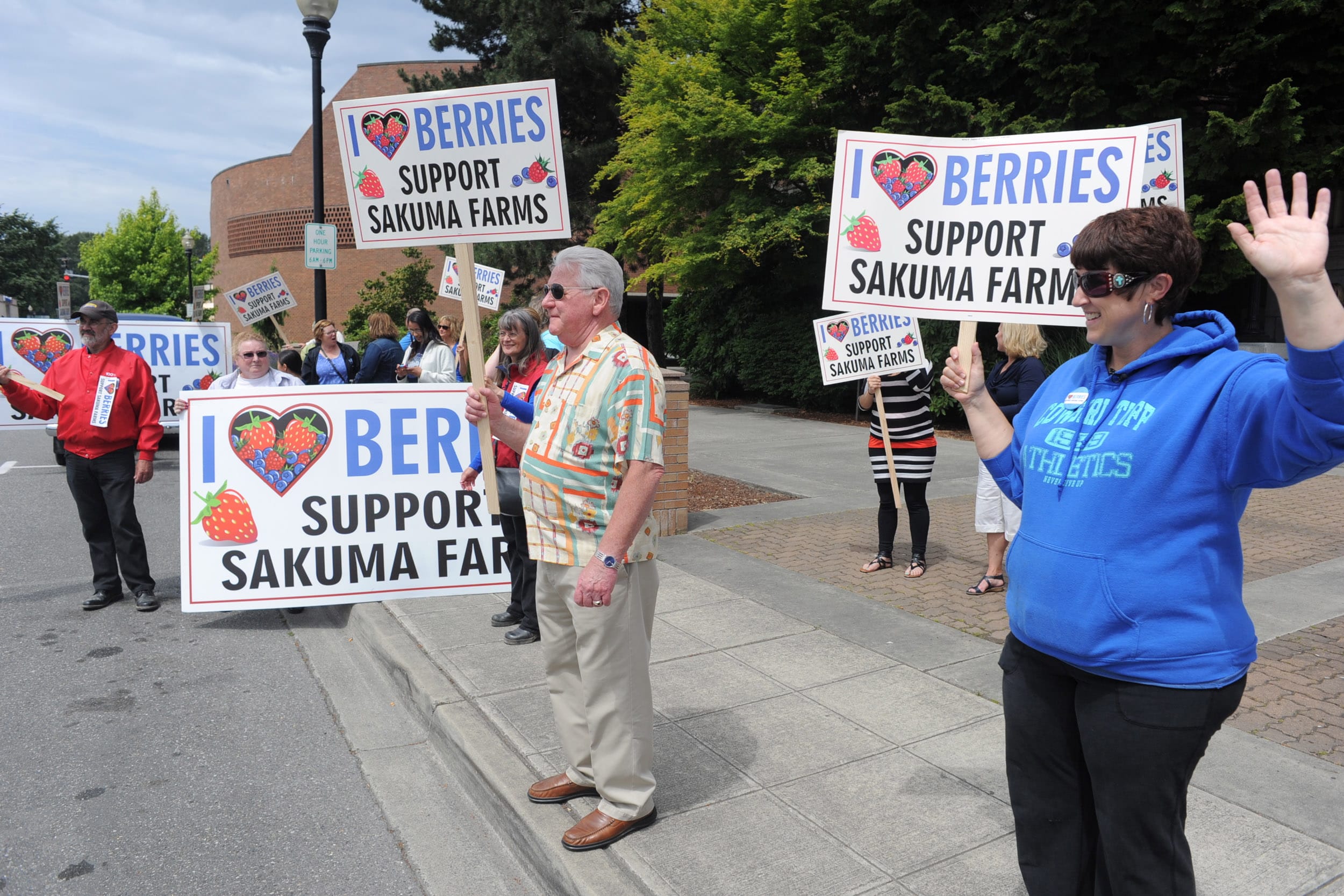 Dozens of demonstrators stand on Kincaid Street in Mount Vernon on Thursday to show support for Sakuma Bros. Farms during a rally in front of the Skagit County courthouse. The rally preceded a court hearing that decided the Sakuma Bros. Farms were obligated to provide housing to farmworkers and their families. Familias Unidas por la Justicia u2014 a labor group formed at the farm the previous season u2014 brought the case against Sakuma Bros. Farms after the farm announced earlier in the year that workers who missed more than five days last season would not be rehired and nonworking family members would not be housed. Both moves were taken as retaliation for workersu2019 participation in strikes and boycotts, attorneys for the group said.