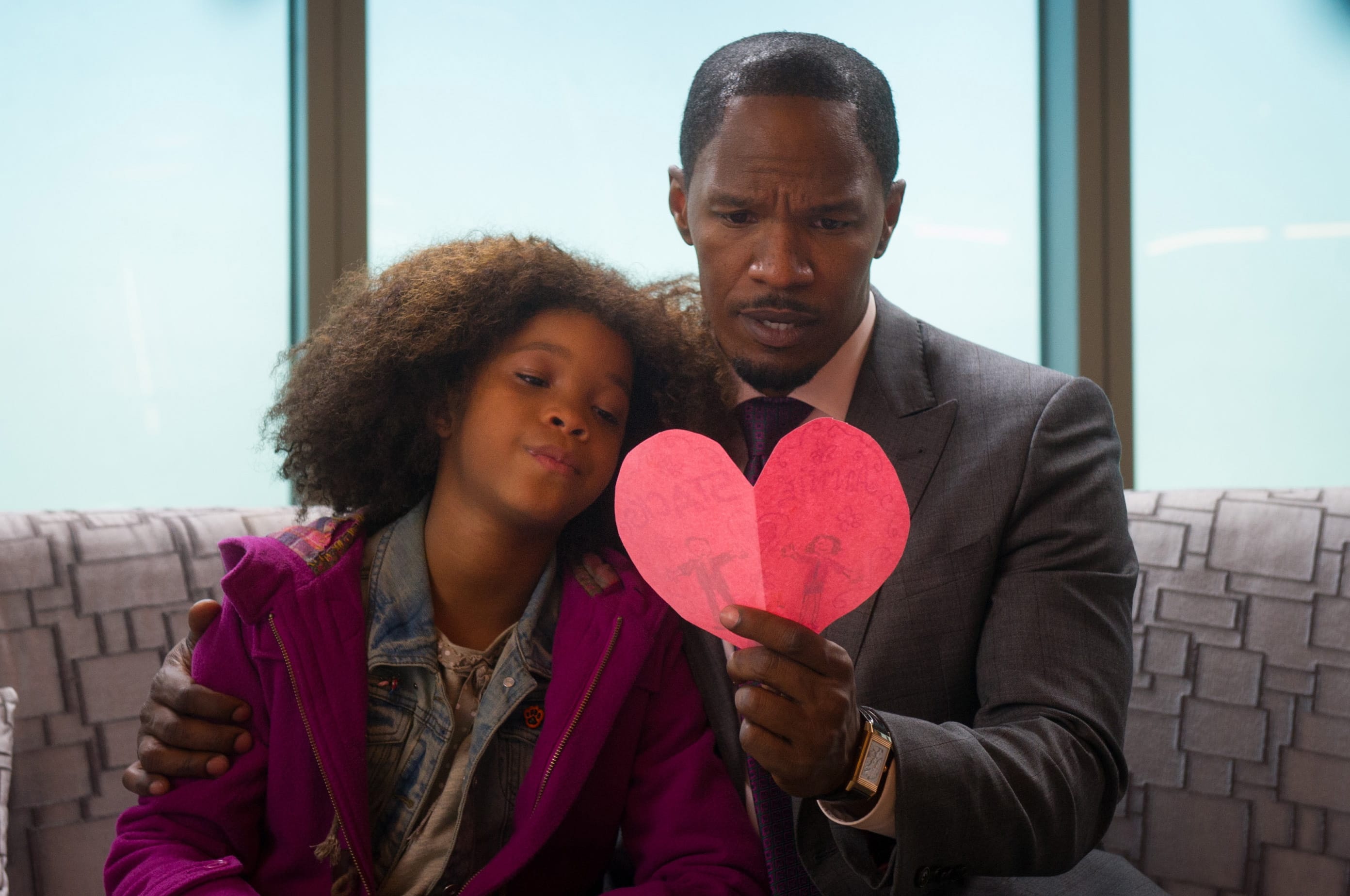 Colombia Pictures - Sony
Quvenzhan? Wallis, as Annie, and Jamie Foxx, as Will Stacks, look at a card she made for him in a scene from  &quot;Annie.&quot;