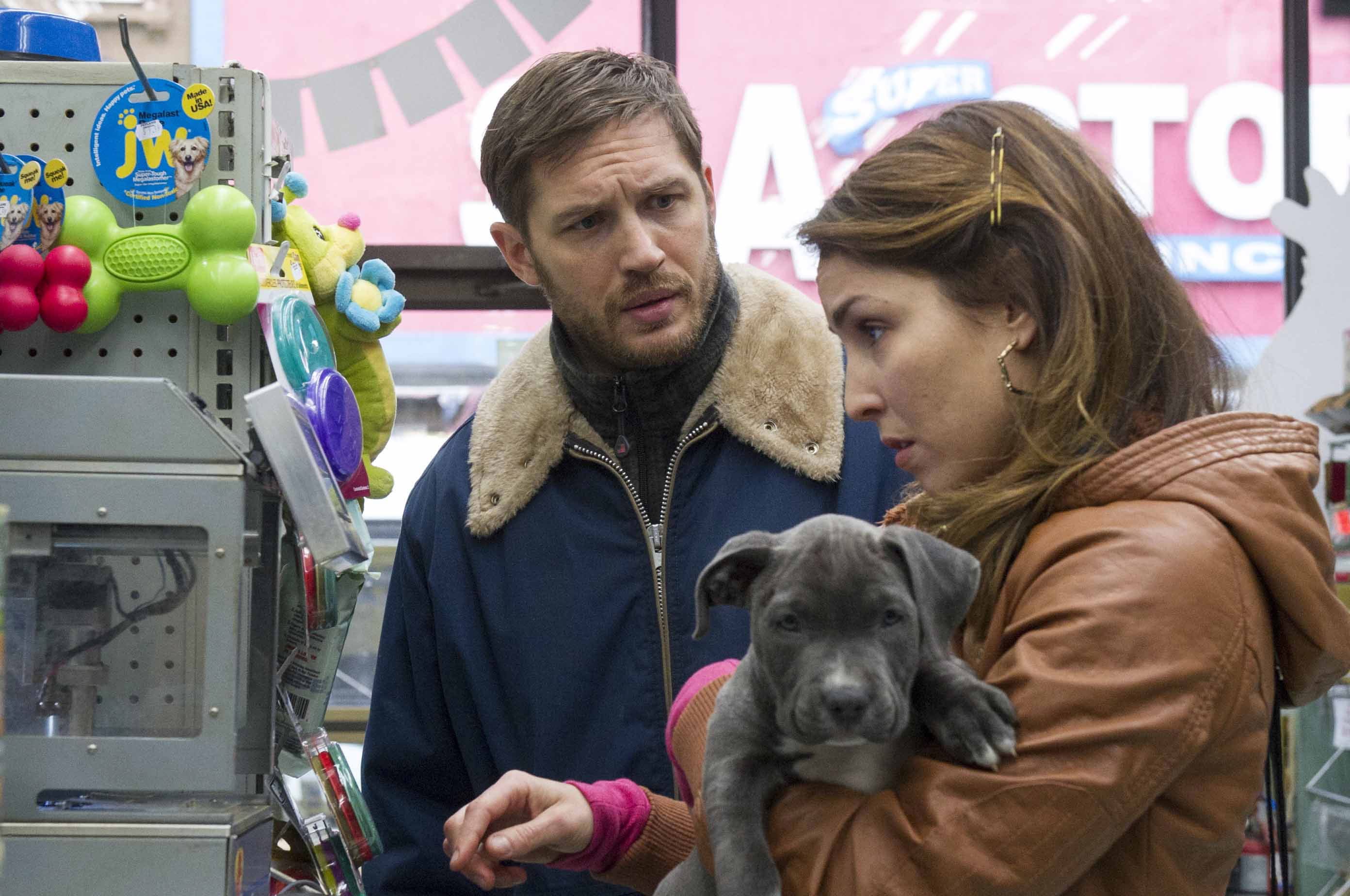 Barry Wetcher/20th Century Fox, Fox Searchlight
Tom Hardy and Noomi Rapace bond over a puppy in &quot;The Drop.&quot;