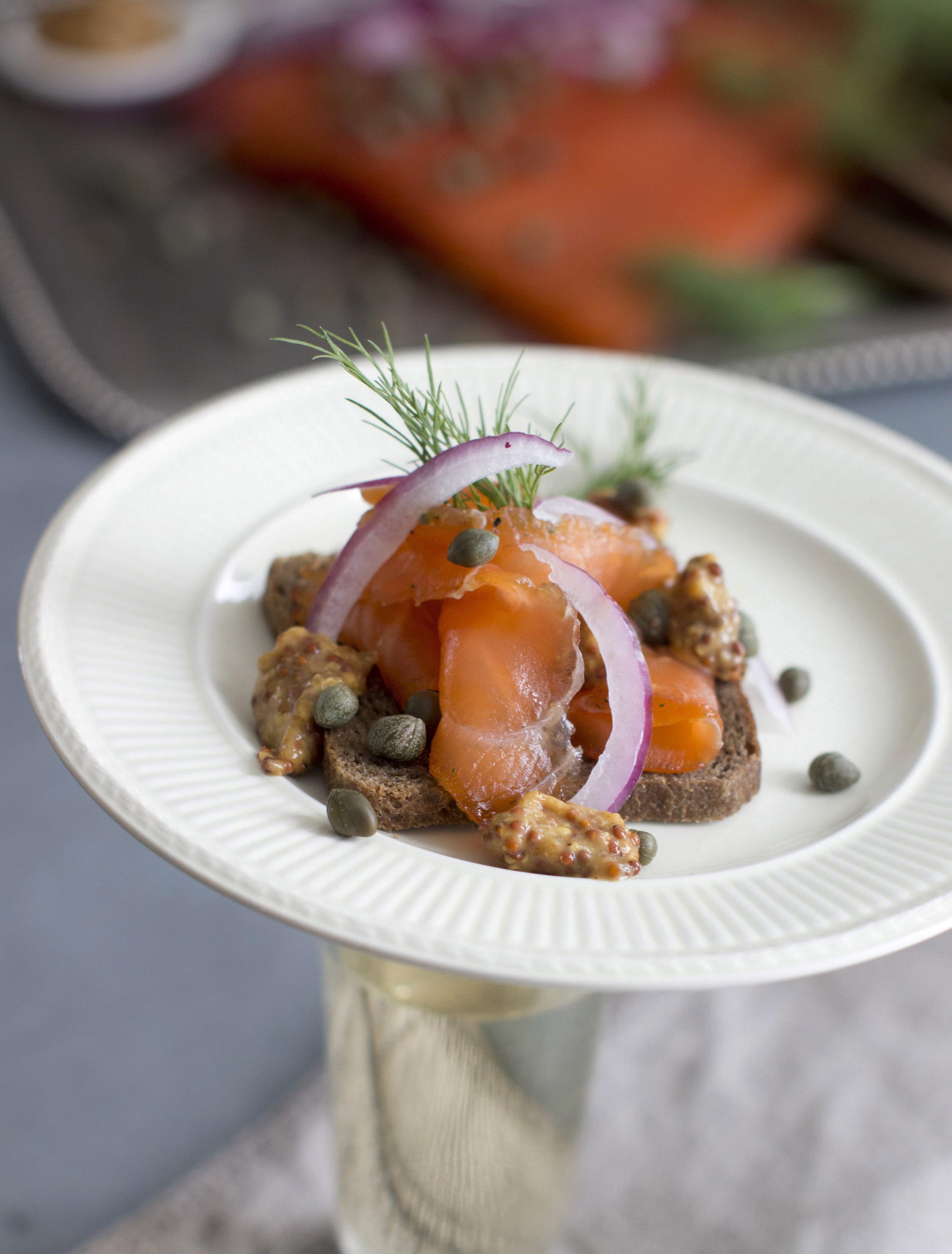 Gravlax, cured salmon known by its Nordic name, generally is made by dry-curing fillets of salmon in a blend of sugar, kosher salt, fresh dill and a variety of other seasonings.
