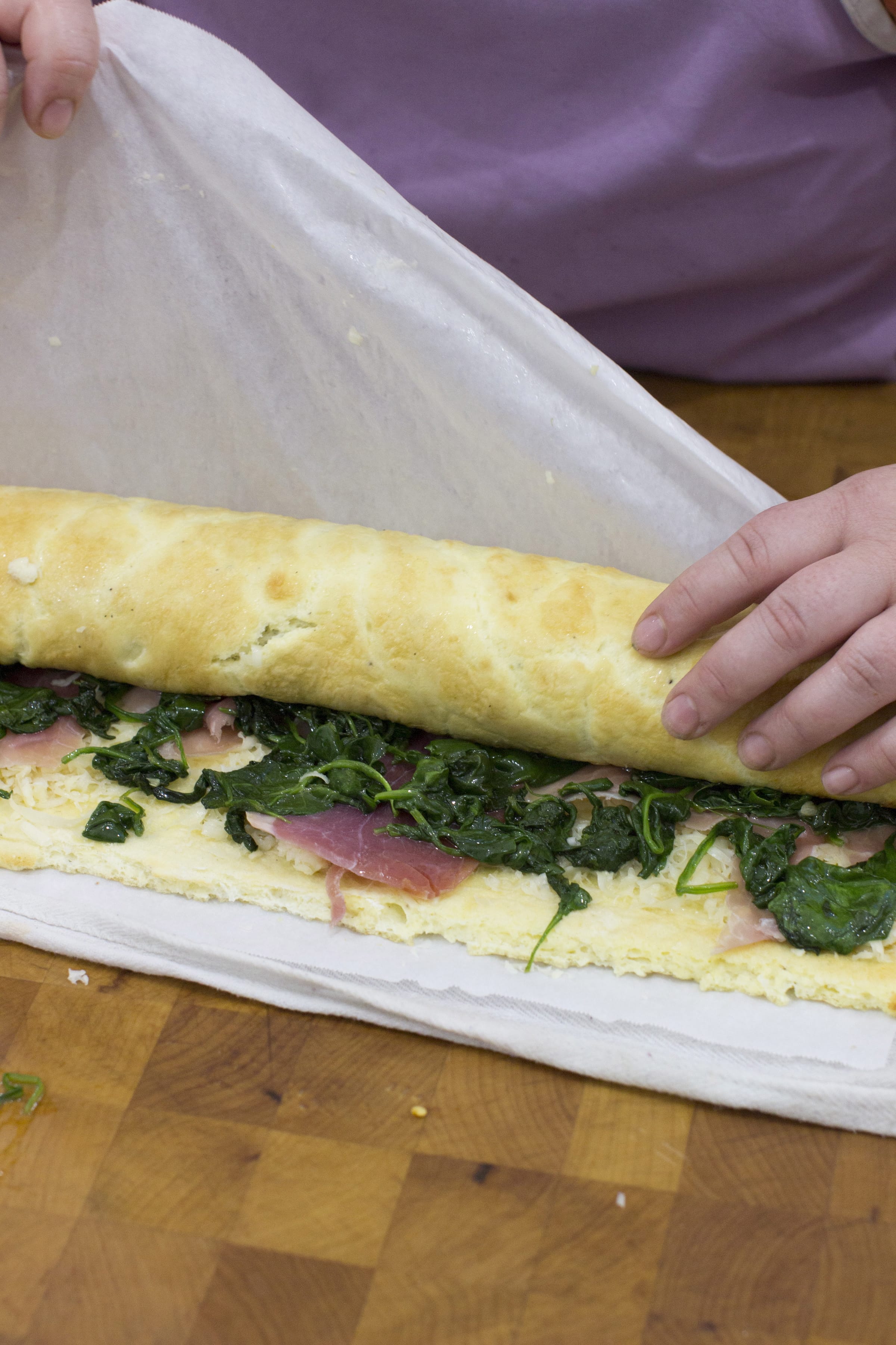 The making of an Egg Roulade Stuffed With Prosciutto, Spinach And Roasted Red Pepper