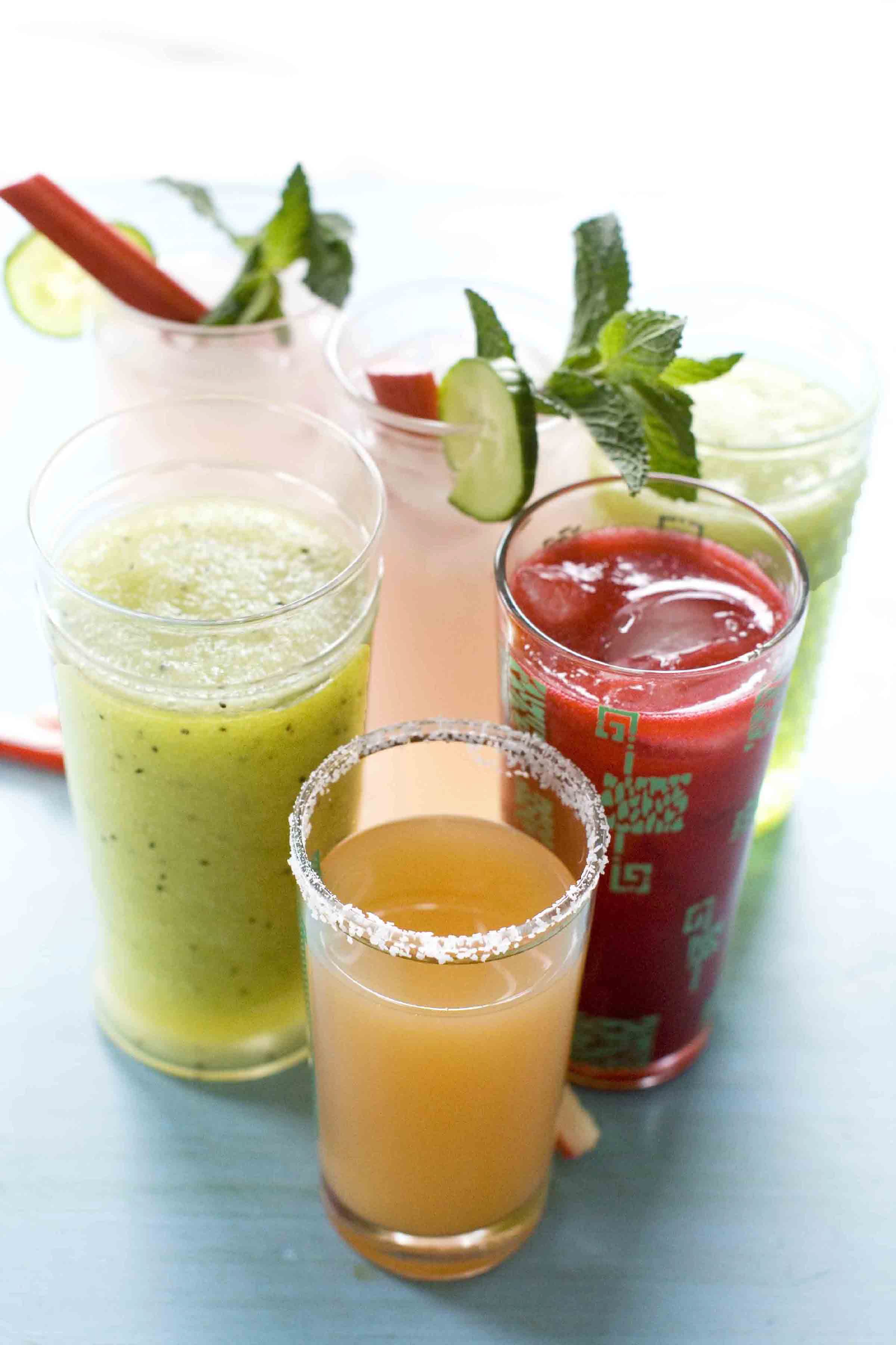 Clockwise from left: Green Granny Slush, Cucumber Rhubarb Mojito, Raspberry Daiquiri and Ruby Rita drinks.