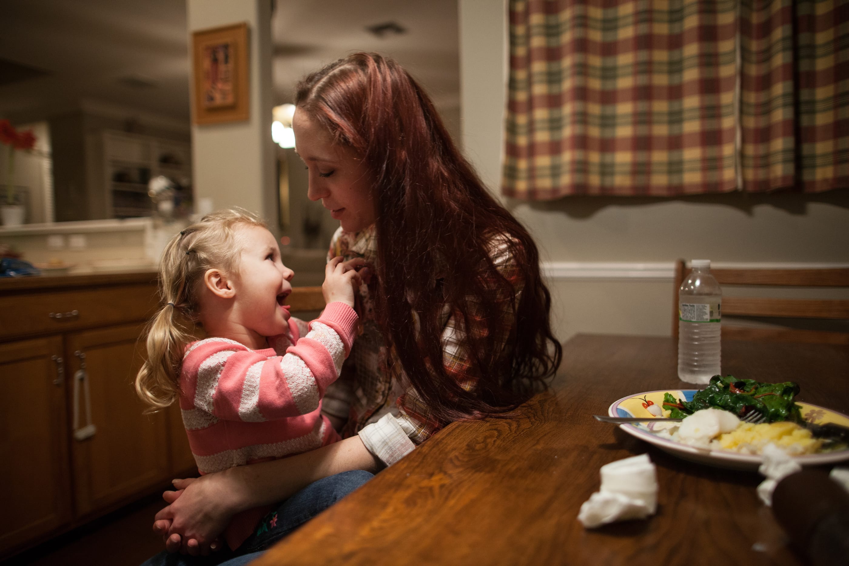 Maggie Barcellano sits down for dinner with her daughter, Zoe, 3, at Barcellano's father's house in Austin, Texas on Saturday. Barcellano, who lives with her father, enrolled in the food stamps program to help save up for paramedic training while she works as a home health aide and raises her daughter. Working-age people now make up the majority in U.S.