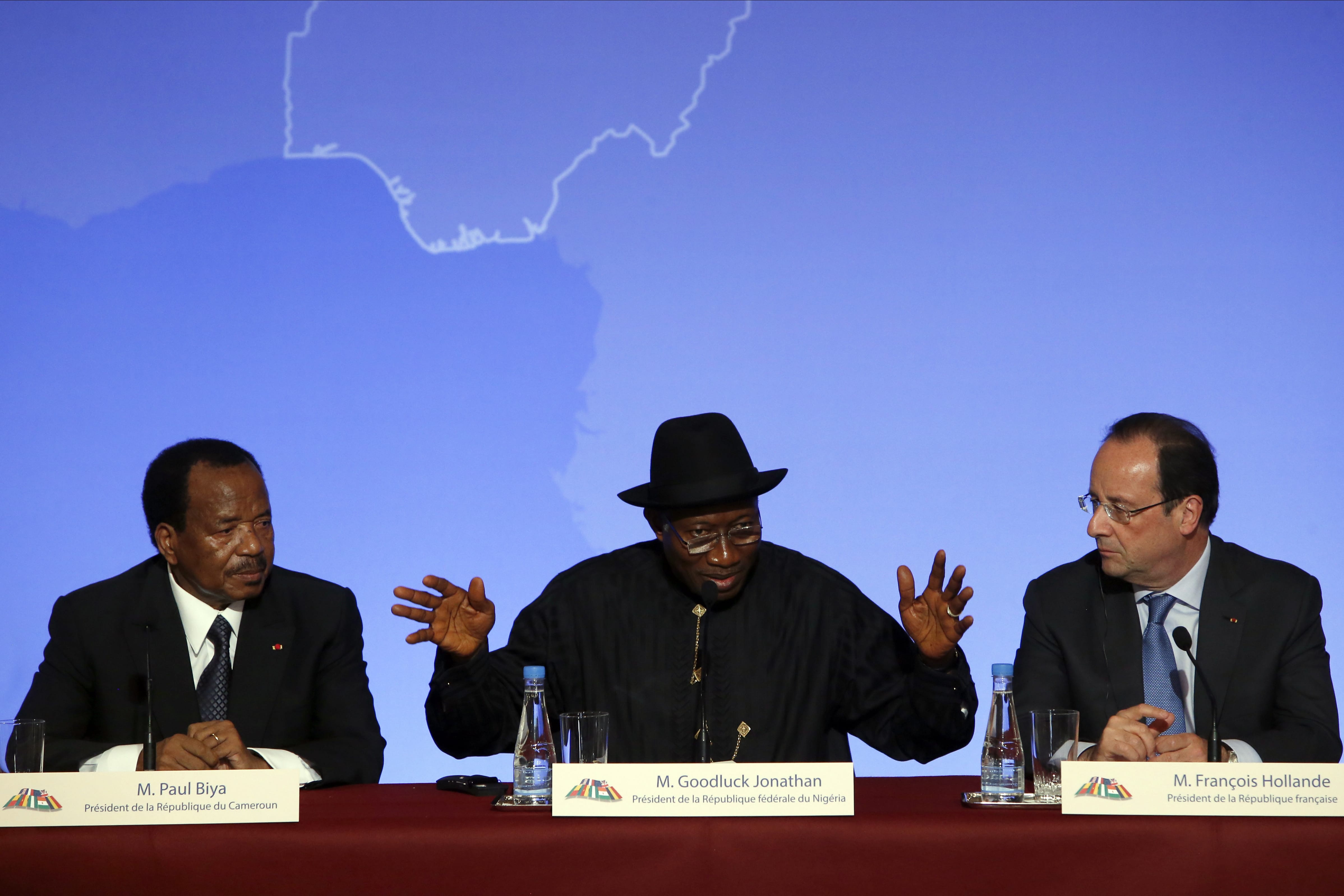 Nigerian President Goodluck Jonathan, center, answers a reporter's questions as Cameroonian  President Paul Biya, left, and French President Francois Hollande look on Saturday during the press conference ending the &quot;Paris Summit for Security in Nigeria,&quot; at the Elysee Palace in Paris. Leaders from Africa as well as officials from the United States, Britain and France met to coordinate a response to Boko Haram, the fundamentalist group that abducted more than 300 girls and is accused of hundreds of deaths in the past year alone.