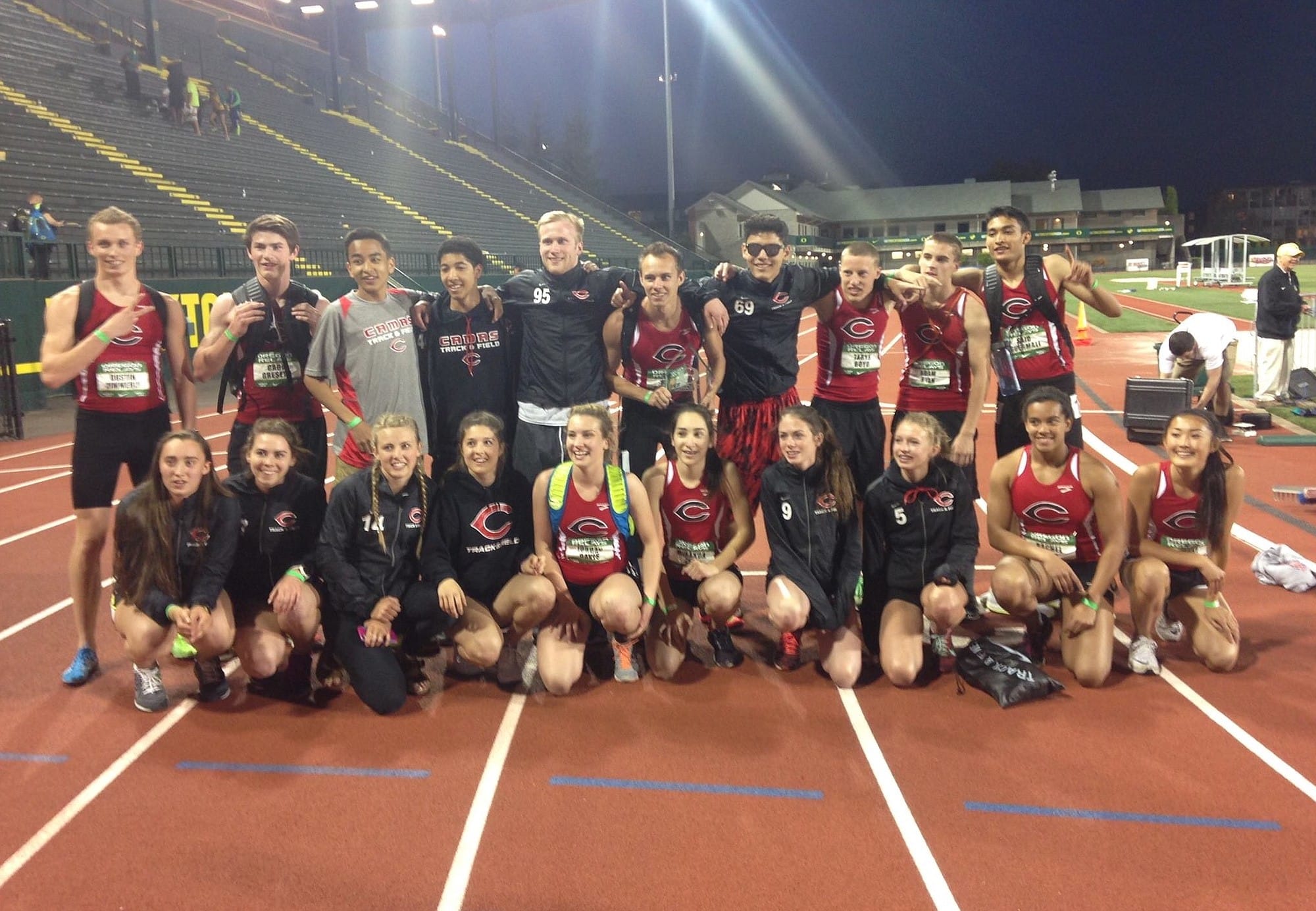 The Camas High School track and field team celebrates winning the high school team title at the Oregon Relays on Saturday in Eugene, Ore.