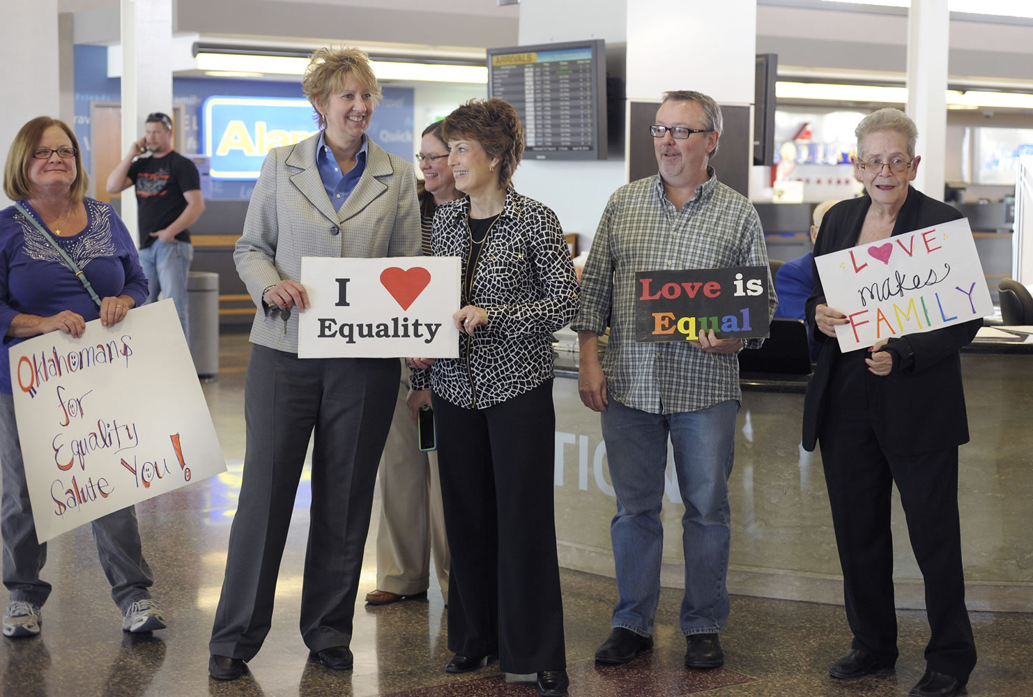 Oklahomans for Equality gather at Tulsa International Airport with their signs for a send off celebration in support for the plaintiffs in the Oklahoma Marriage Equality lawsuit as they head to the 10th Circuit Court of Appeals in Denver on Wednesday.