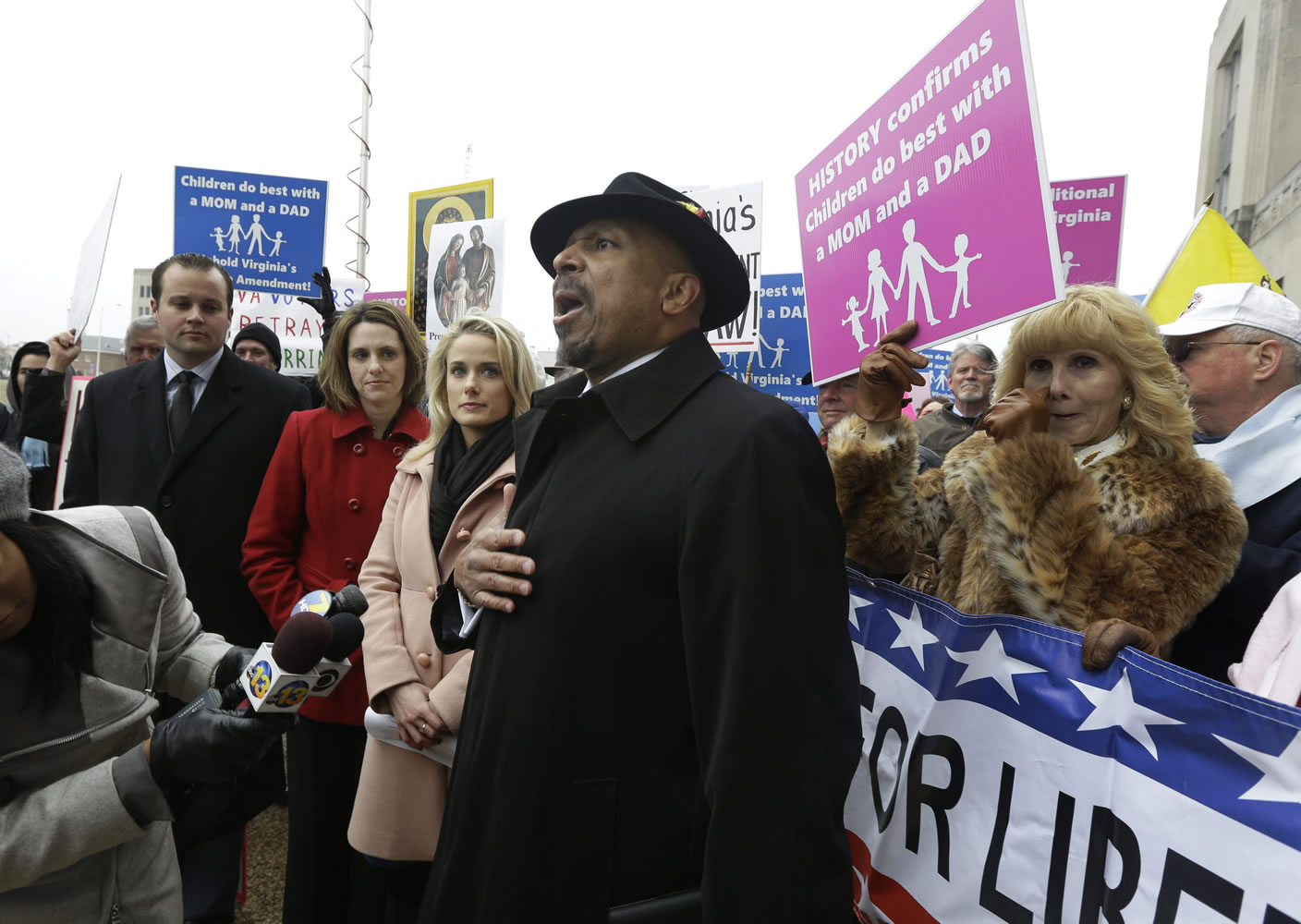 Former Republican candidate for lieutenant governor E.W. Jackson, center, speaks to the media during a demonstration outside Federal Court in Norfolk, Va., on Feb. 4.