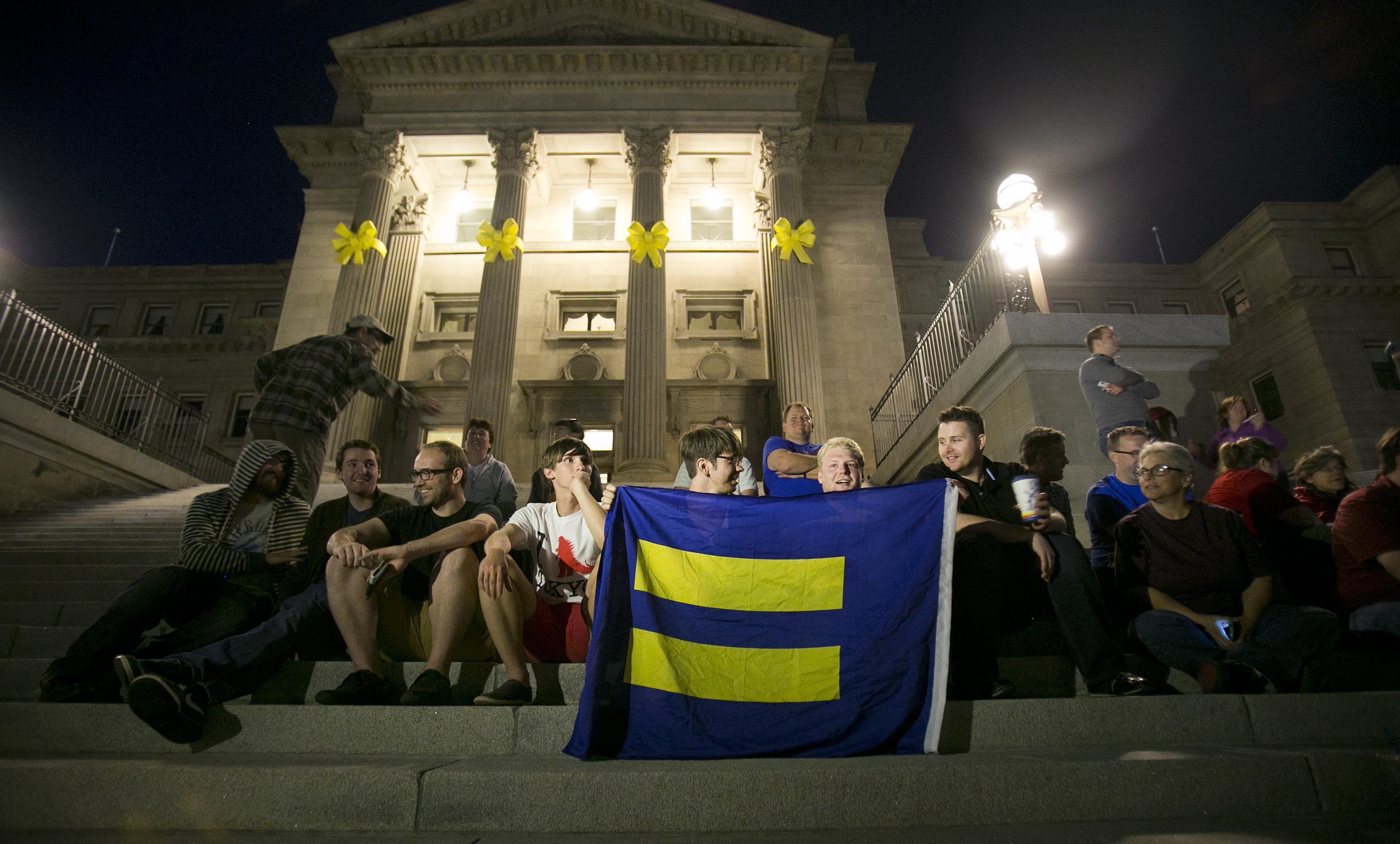 Same-sex marriage supporters gather on the steps of the Idaho Statehouse in Boise on Tuesday night  after U.S.