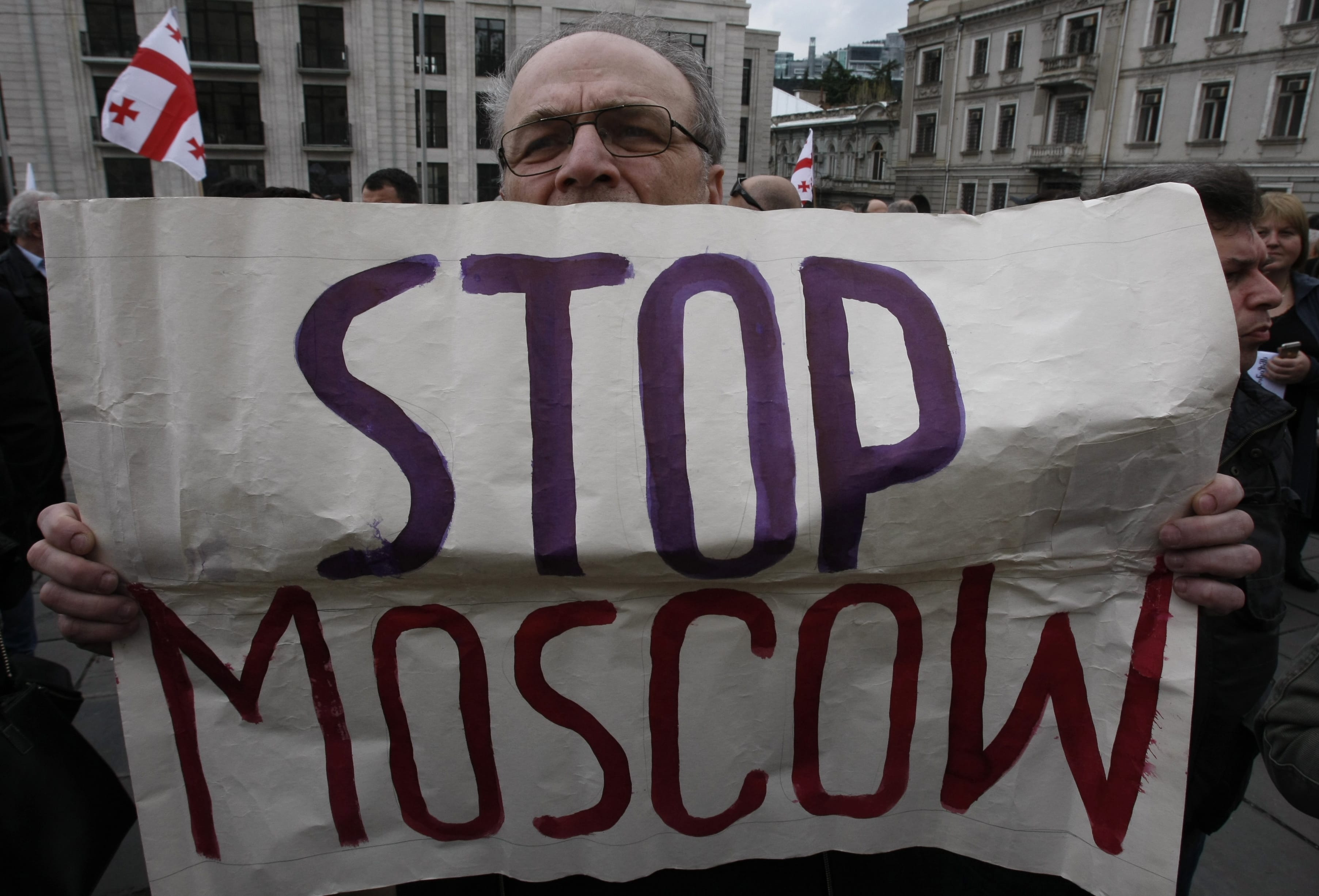 A man holds a poster reading &quot;Stop Moscow&quot; during a rally in support of United Ukraine in Tbilisi, Georgia, on Sunday.  The U.S. Ambassador to the United Nations, Samantha Power, told ABC's &quot;This Week&quot; program on Sunday that recent violence in Ukraine &quot;bears the tell-tale signs of Moscow's involvement&quot; and went on to say. &quot;It's professional, it's coordinated.