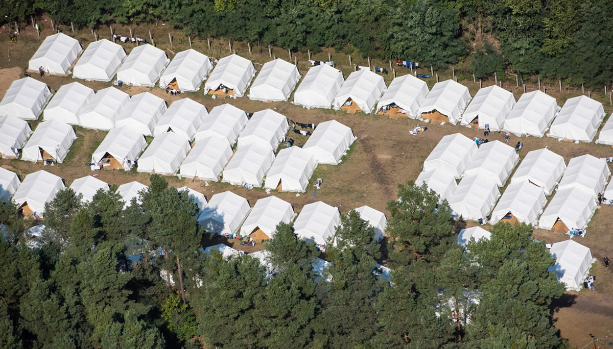 Aerial view of a provisory tent village for refugees and migrants  in Eisenhuettenstadt, Germany, Saturday Sept. 12, 2015..