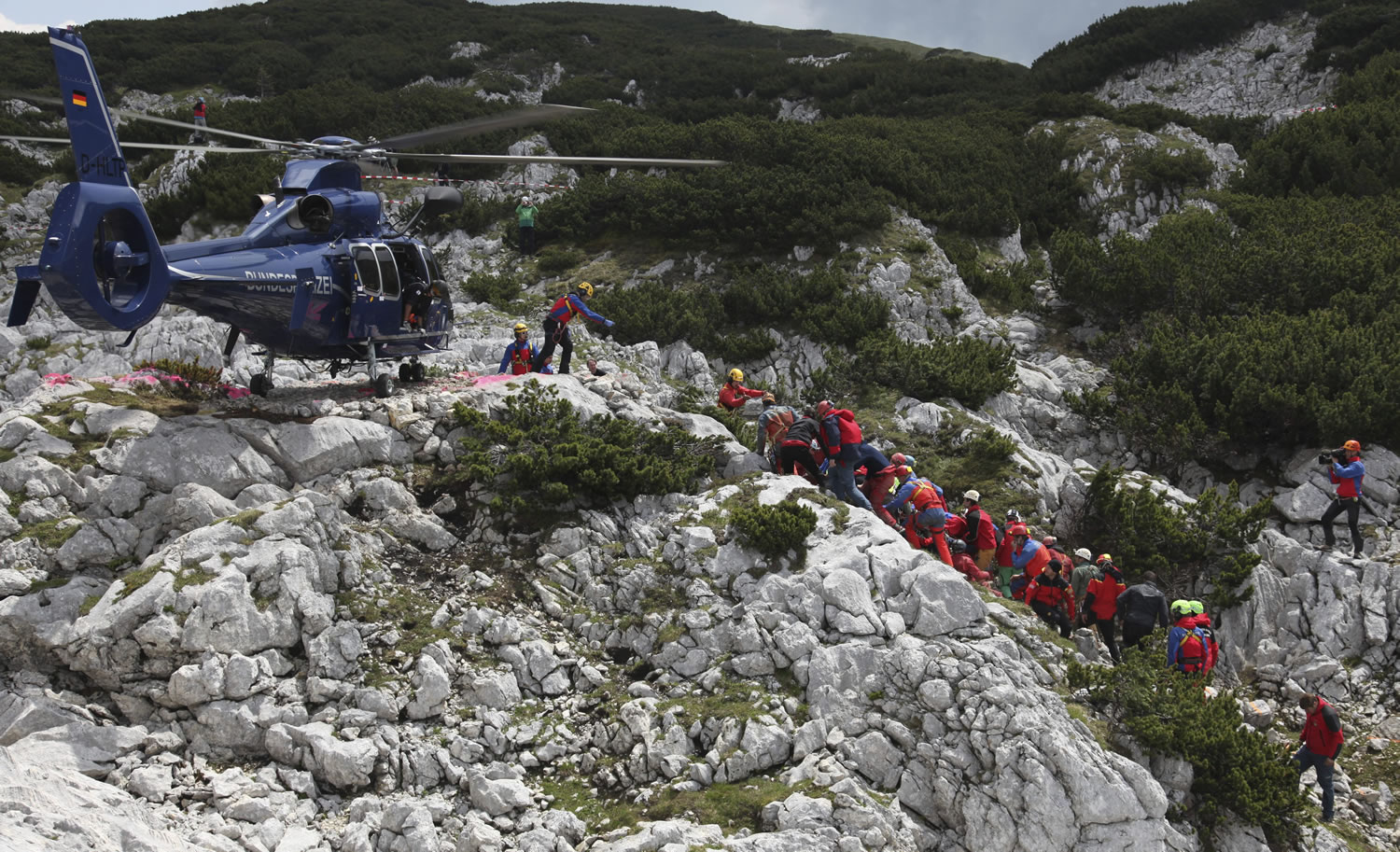 Rescuers carry a stretcher with injured German cave researcher Johann Westhauser to a helicopter Thursday near Berchtesgaden on the German-Austrian border.