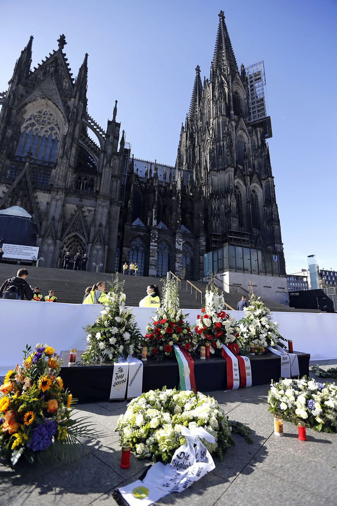 Wreaths are set up in front of the Cologne Cathedral on Friday in Cologne, Germany, where a mourning ceremony was held for the 150 victims of the Germanwings plane crash last month in the French Alps.