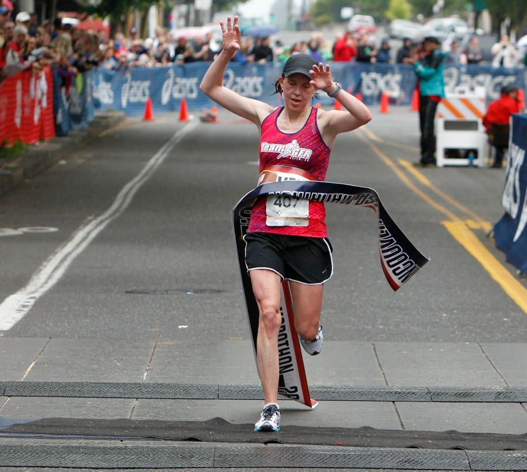 Tonya Lutz of Salem, Ore., wins the women's title in the 2014 Vancouver USA Marathon in 2:57 on Sunday in downtown Vancouver.