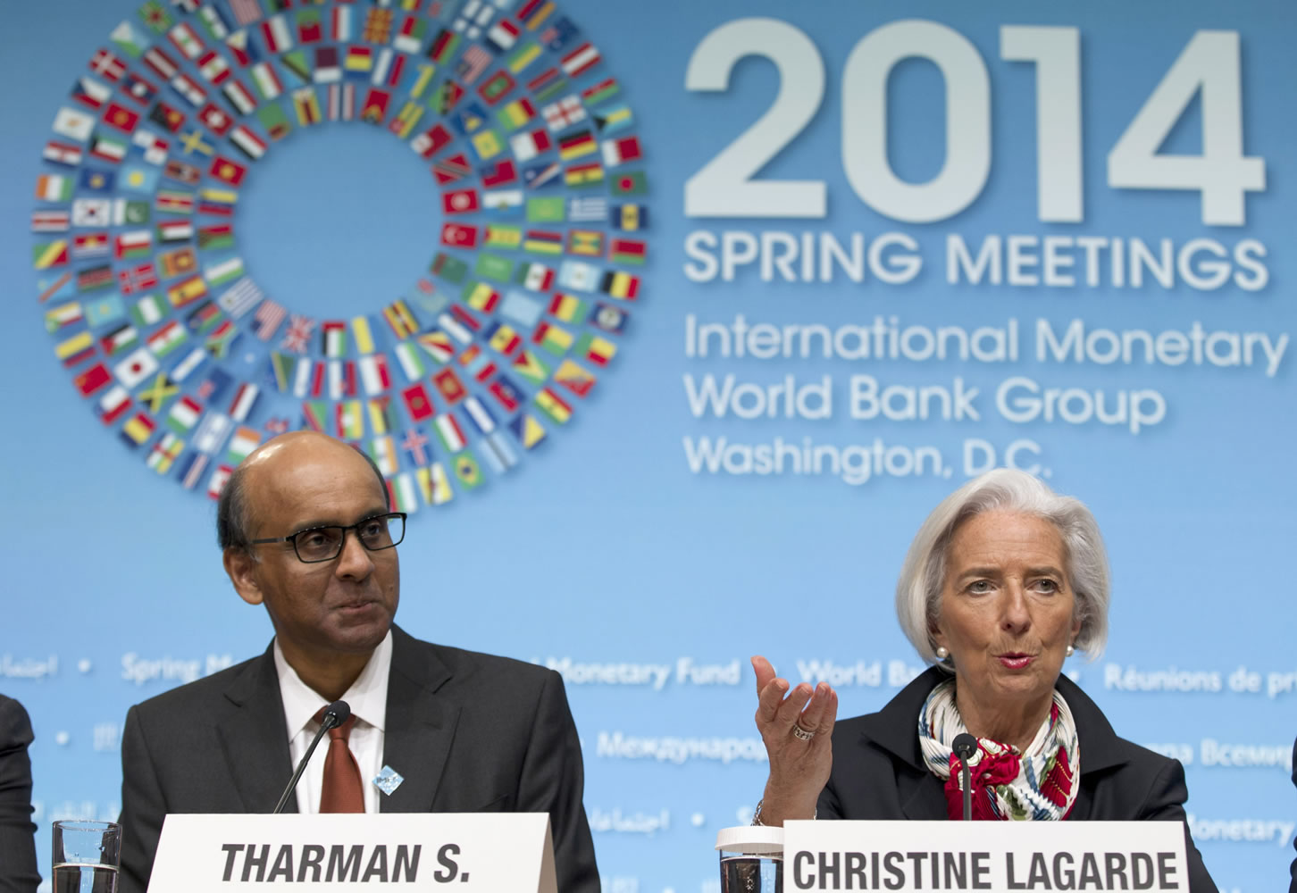 International Monetary Fund Managing Director Christine Lagarde, accompanied by  IMFC Chair and Singapore Finance Minister Tharman Shanmugaratnam, speaks during a news conference Saturday at World Bank Group-International Monetary Fund Spring Meetings in Washington.