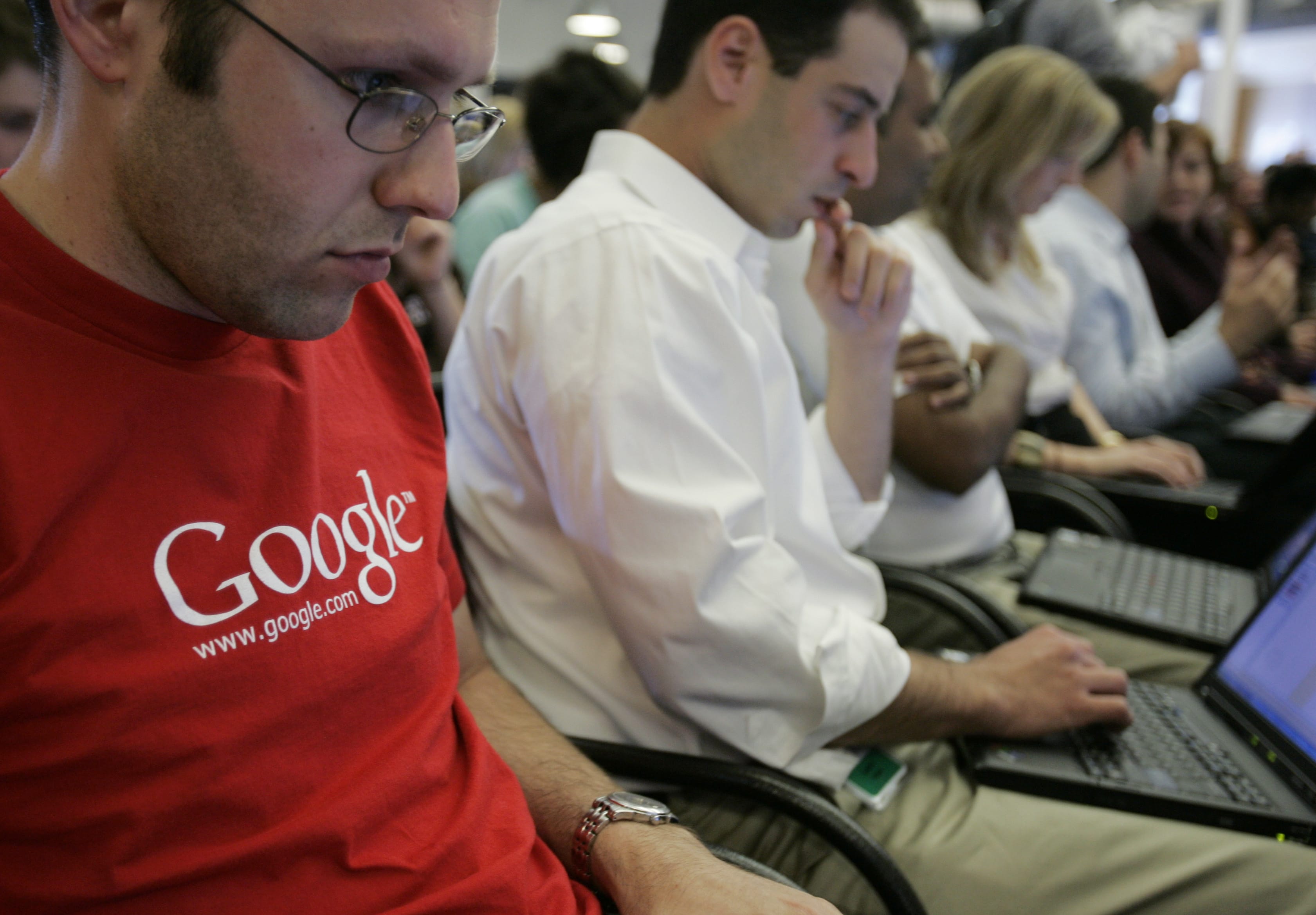 Google employees work on their laptops at Google headquarters in Mountain View, Calif., in 2007.