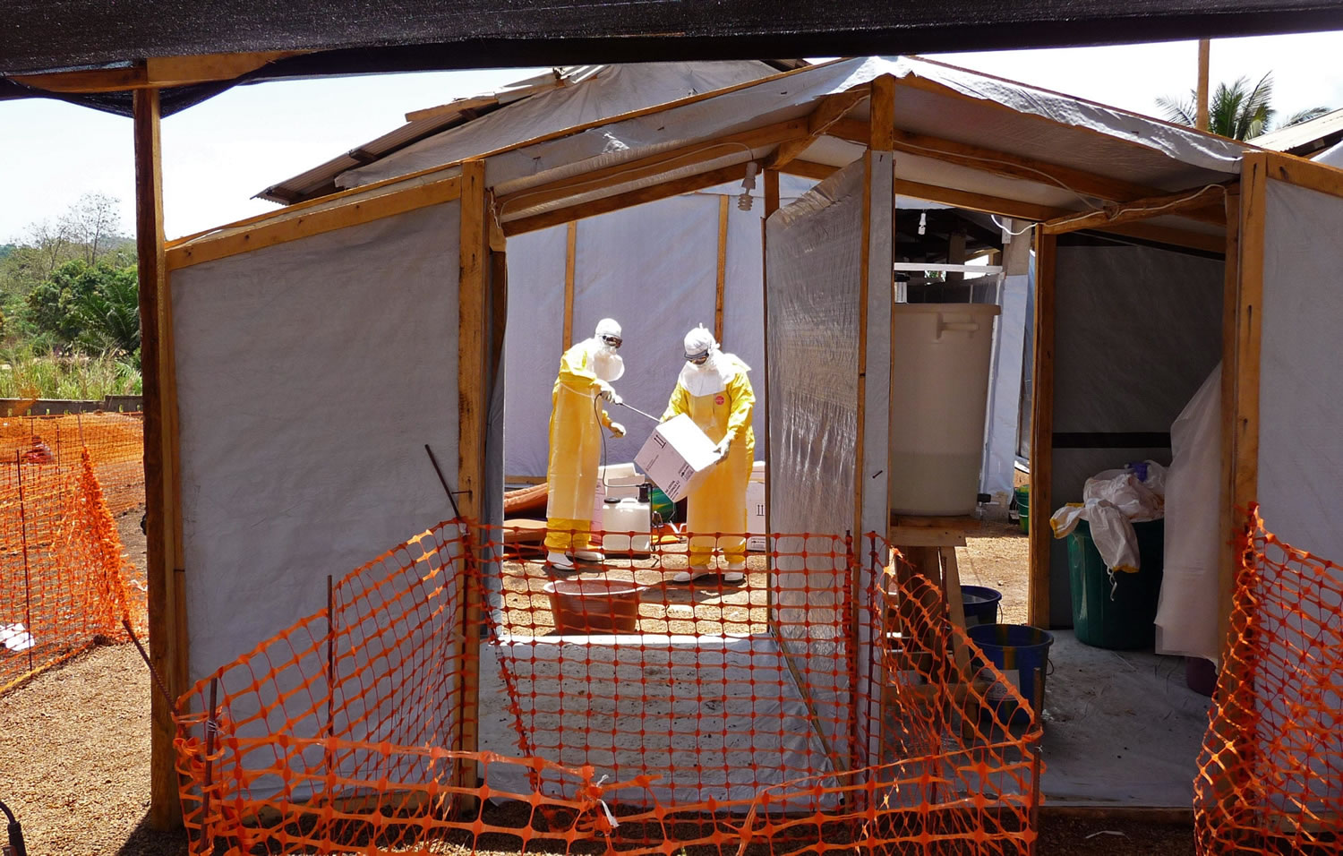 Healthcare workers prepare isolation and treatment areas for their Ebola and hemorrhagic fever operations Friday in Guekedou, Guinea.