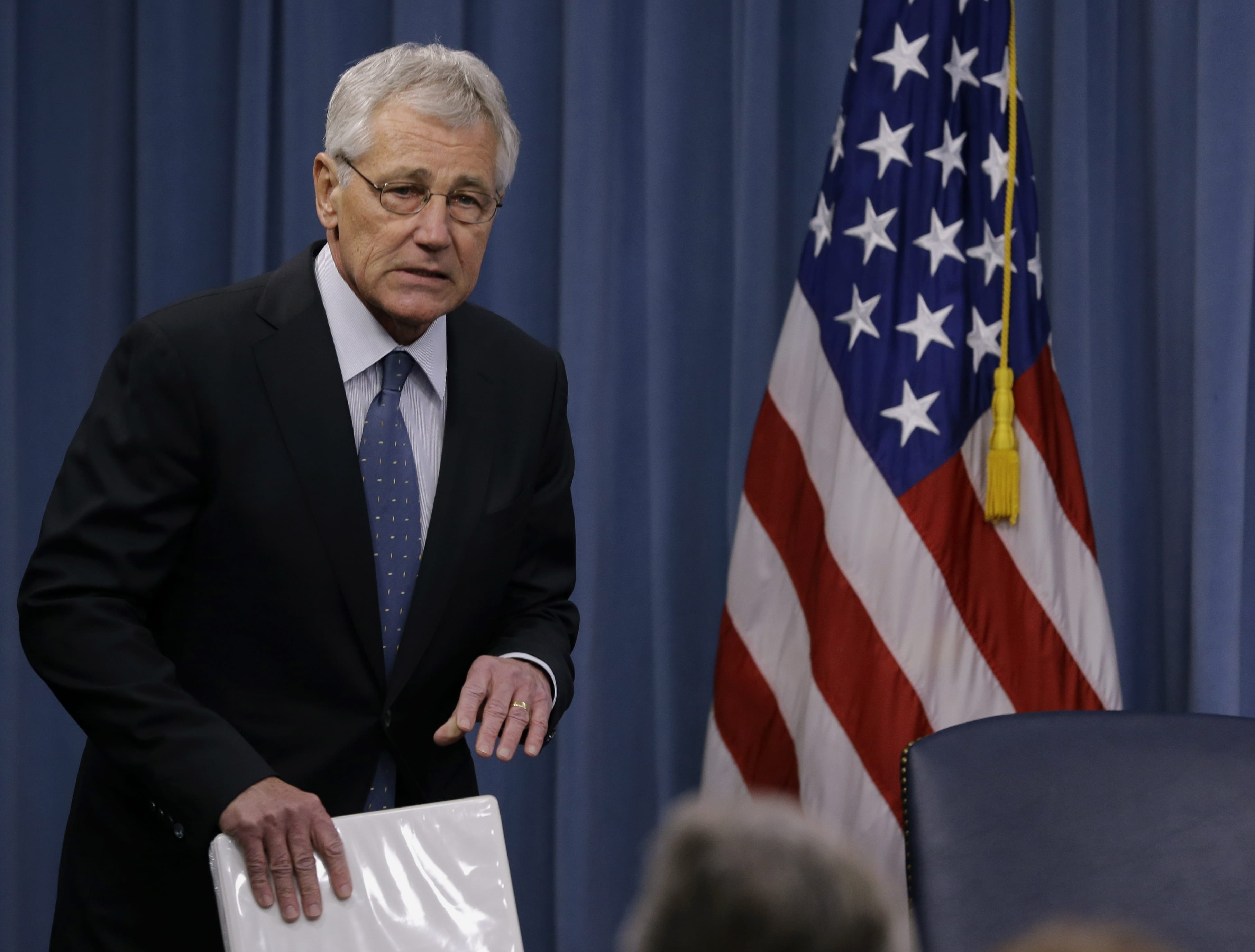 Defense Secretary Chuck Hagel arrives to brief reporters at the Pentagon on Monday. Hagele recommended shrinking the Army to its smallest size since the buildup to U.S.