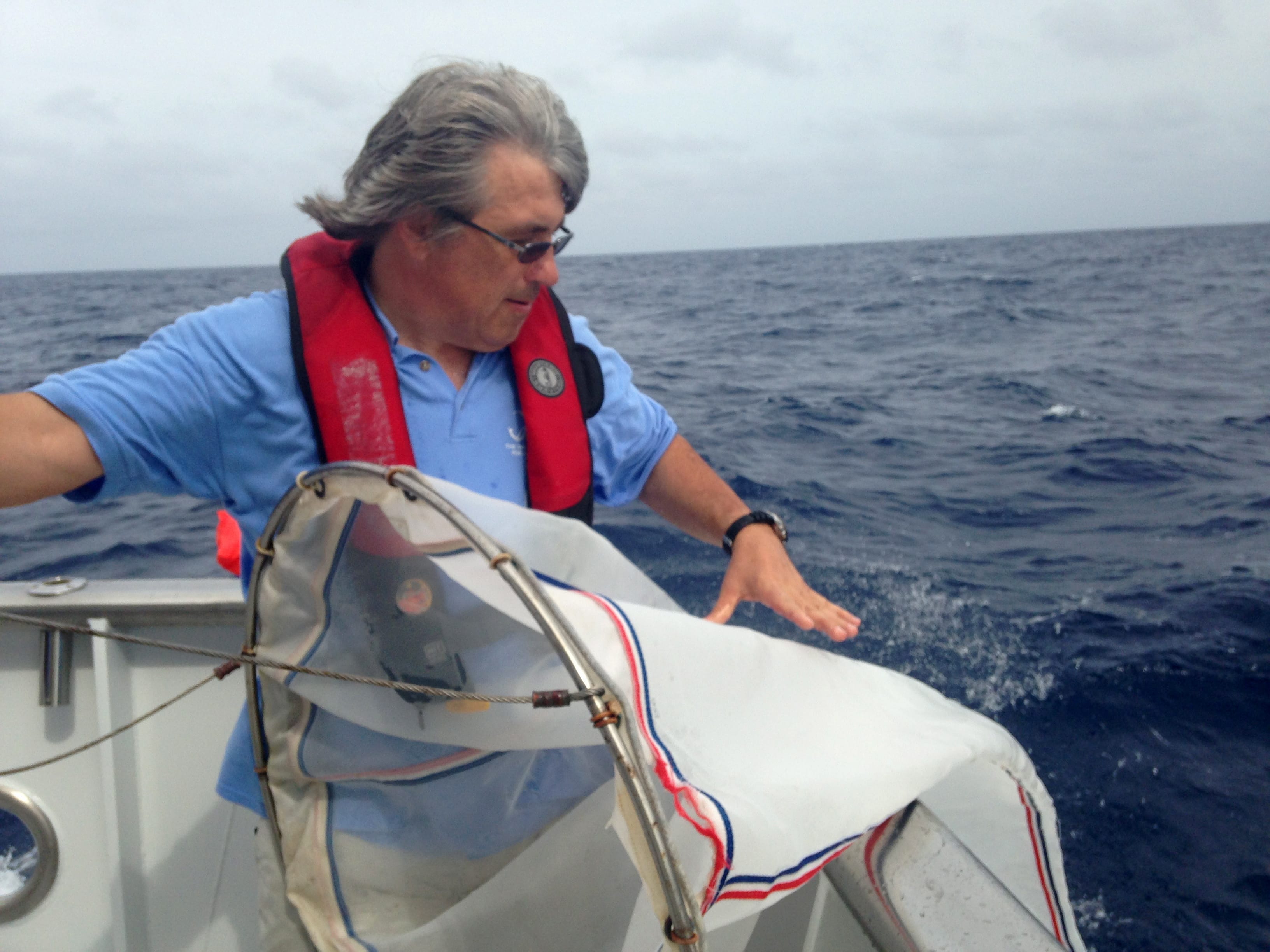 University of Florida neurobiologist Leonid Moroz pulls a net from the Gulf Stream off the coast of Florida, to examine invertebrate species.