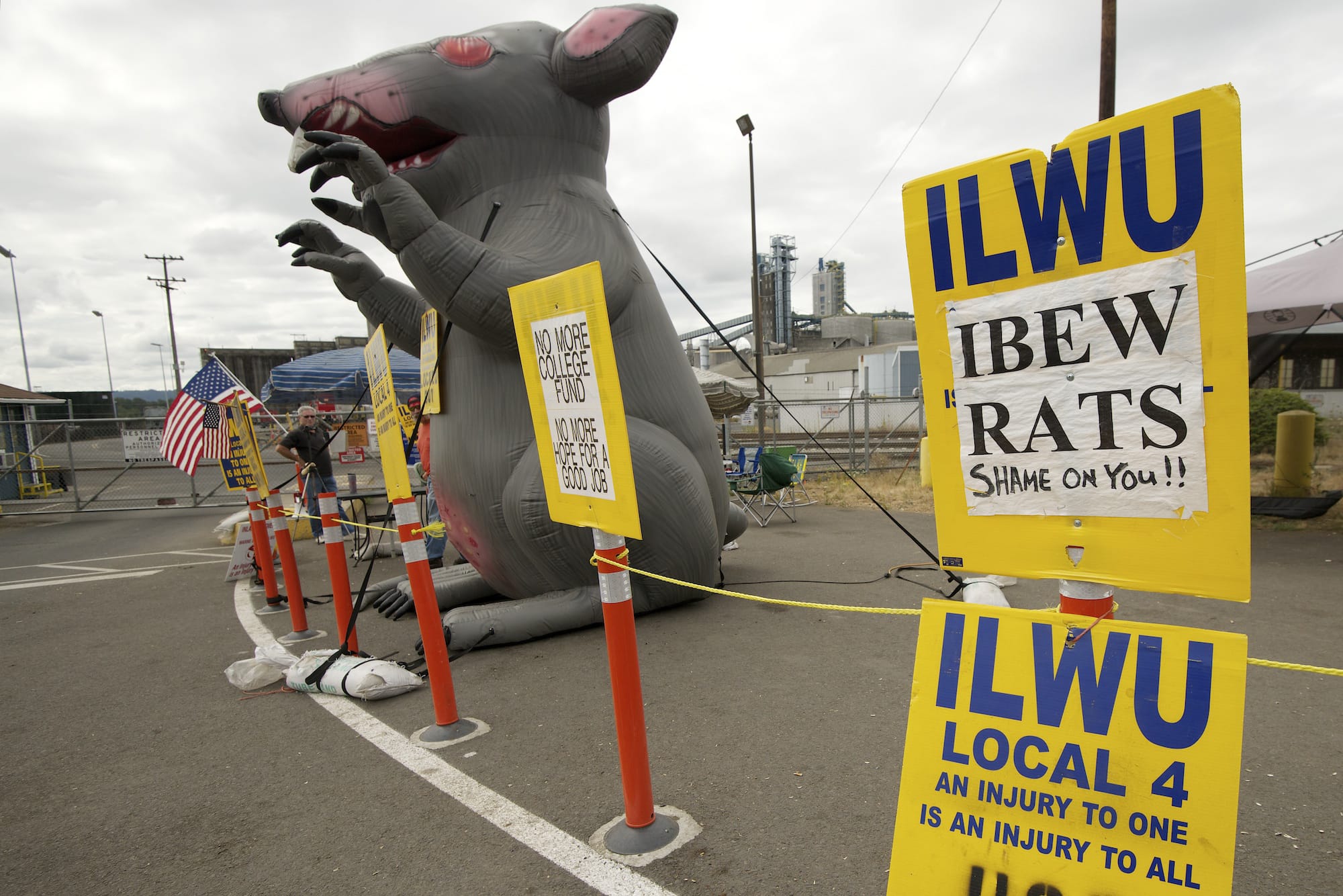 Late July or early August 2013: Union dockworkers introduce a new prop in their protest against United Grain: a 12-foot-tall inflatable rat.