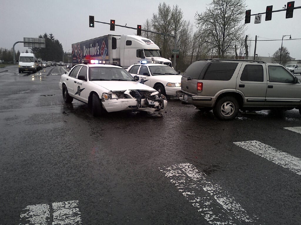 Washington State Patrol is investigating a crash between a patrol car and another vehicle in the Orchards area Friday morning.