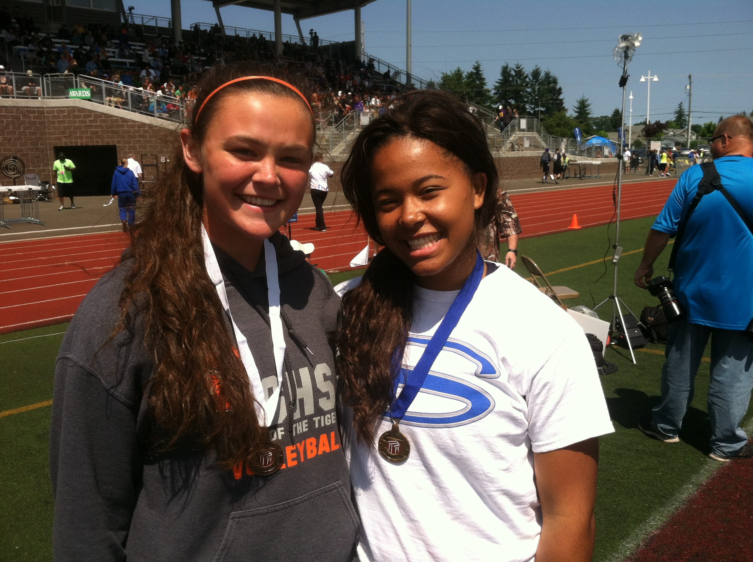 Aubrey Ward-El, right, of Skyview stands with Jossilyn Blackman of Battle Ground after the awards ceremony for the 4A girls shot put at the state track and field meet Friday in Tacoma.