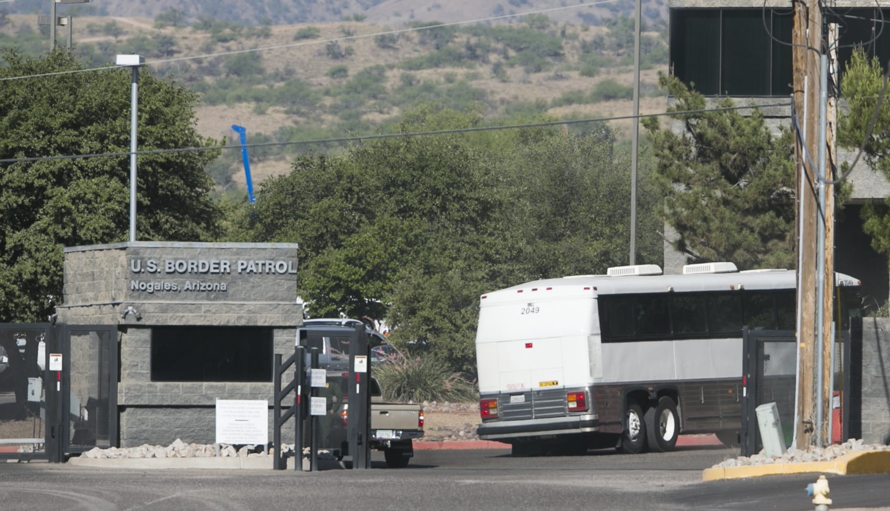 A bus carrying children arrives Saturday at a border patrol facility in Nogales, Ariz.