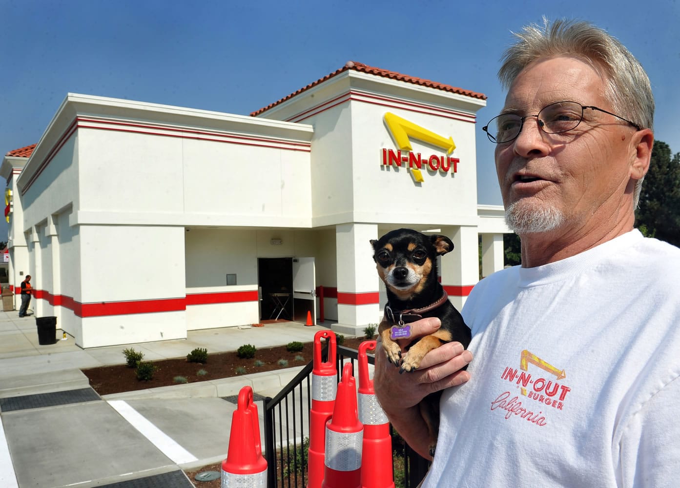 Sam Garrett and Lola of Grants Pass, Ore., are ready for Medford's In-N-Out restaurant to open Aug.