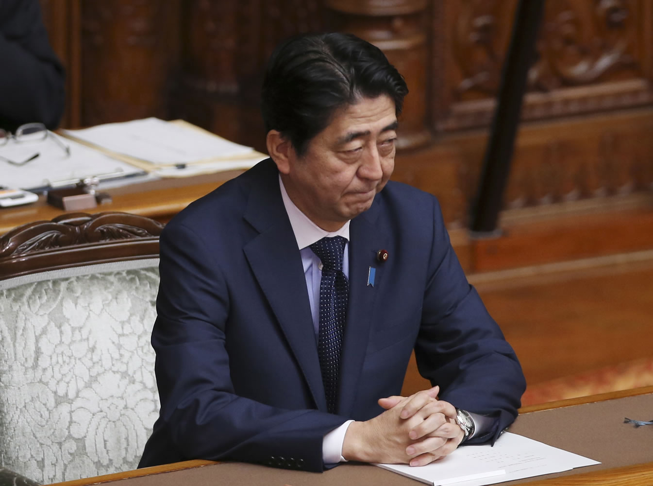 Japanese Prime Minister Shinzo Abe attends the upper house plenary diet session in Tokyo Friday, Sept. 18, 2015 after a censure motion against him was filed by an opposition party in their attempt to block contentious security bills that Abe's ruling party is eager to get final approval by the upper house. The bills would ease restrictions on what the military can do, a highly sensitive issue in a country where many take pride in the postwar pacifist constitution.